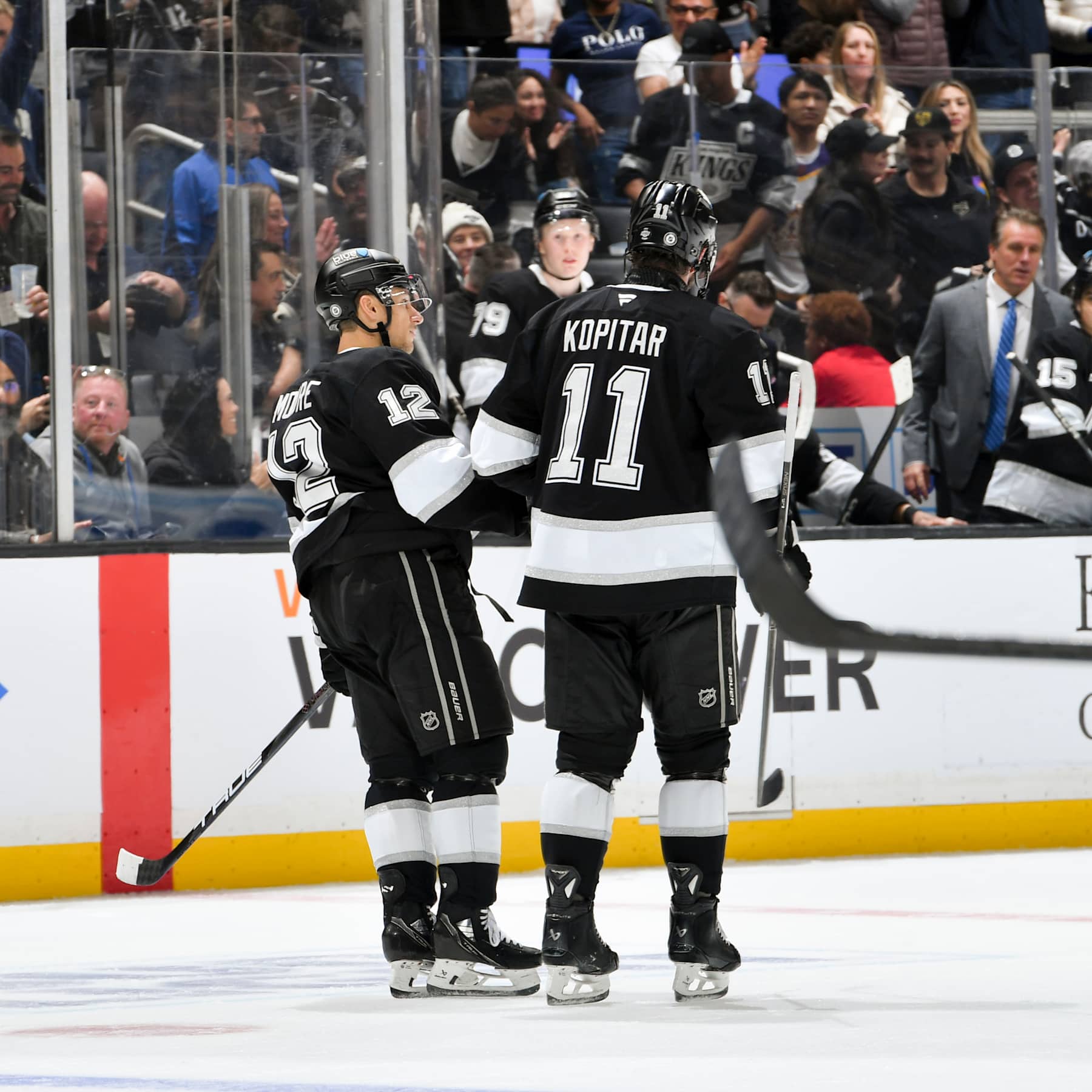 LOS ANGELES, CA - NOVEMBER 30: Trevor Moore #12 of the Los Angeles Kings celebrates his goal with Anze Kopitar #11 during the third period against the Ottawa Senators at Crypto.com Arena on November 30, 2024 in Los Angeles, California. (Photo by Juan Ocampo/NHLI via Getty Images)