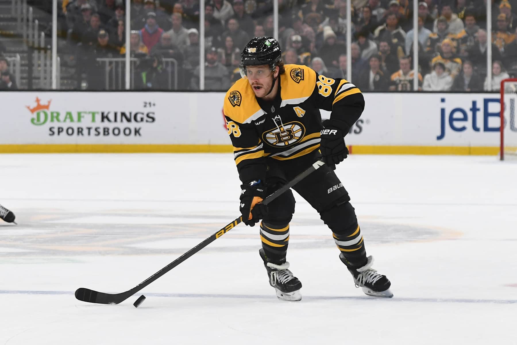 BOSTON, MASSACHUSETTS - DECEMBER 3: David Pastrnak #88 of the Boston Bruins skates with the puck against the Detroit Red Wings on December 3, 2024, at the TD Garden in Boston, Massachusetts. (Photo by Steve Babineau/NHLI via Getty Images)
