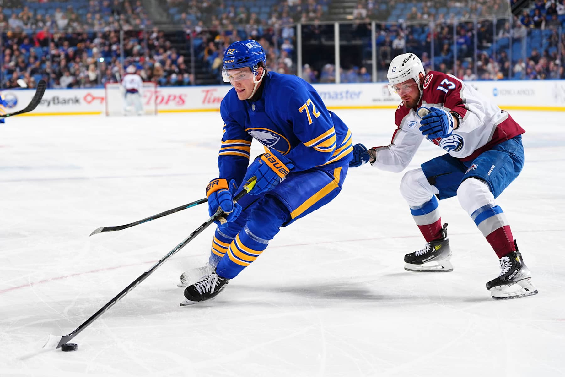 BUFFALO, NEW YORK - DECEMBER 3: Tage Thompson #72 of the Buffalo Sabres controls the puck against Valeri Nichushkin #13 of the Colorado Avalanche during an NHL game on December 3, 2024 at KeyBank Center in Buffalo, New York. (Photo by Ben Ludeman/NHLI via Getty Images)