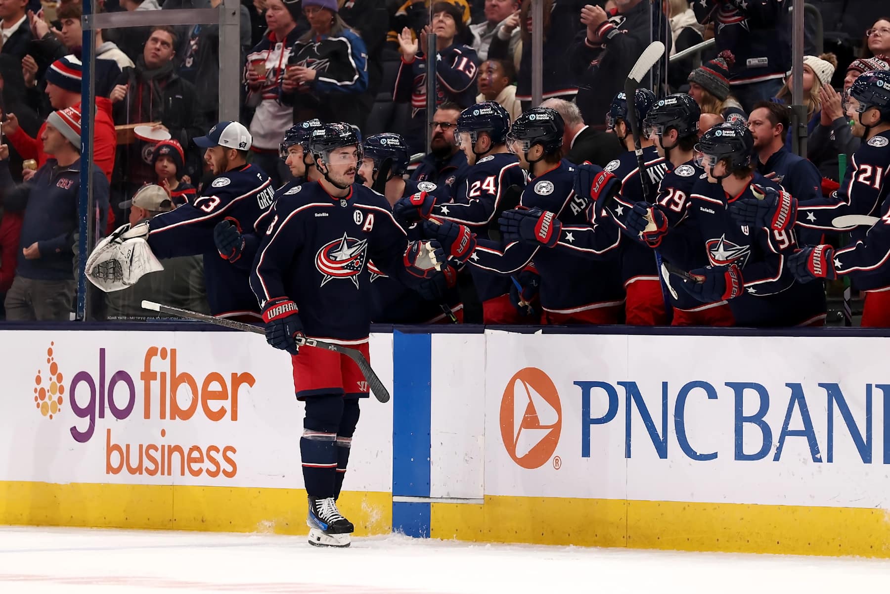 COLUMBUS, OHIO - NOVEMBER 29: Zach Werenski #8 of the Columbus Blue Jackets is congratulated by his teammates after scoring a goal during the game against the Calgary Flames at Nationwide Arena on November 29, 2024 in Columbus, Ohio. (Photo by Kirk Irwin/NHLI via Getty Images)