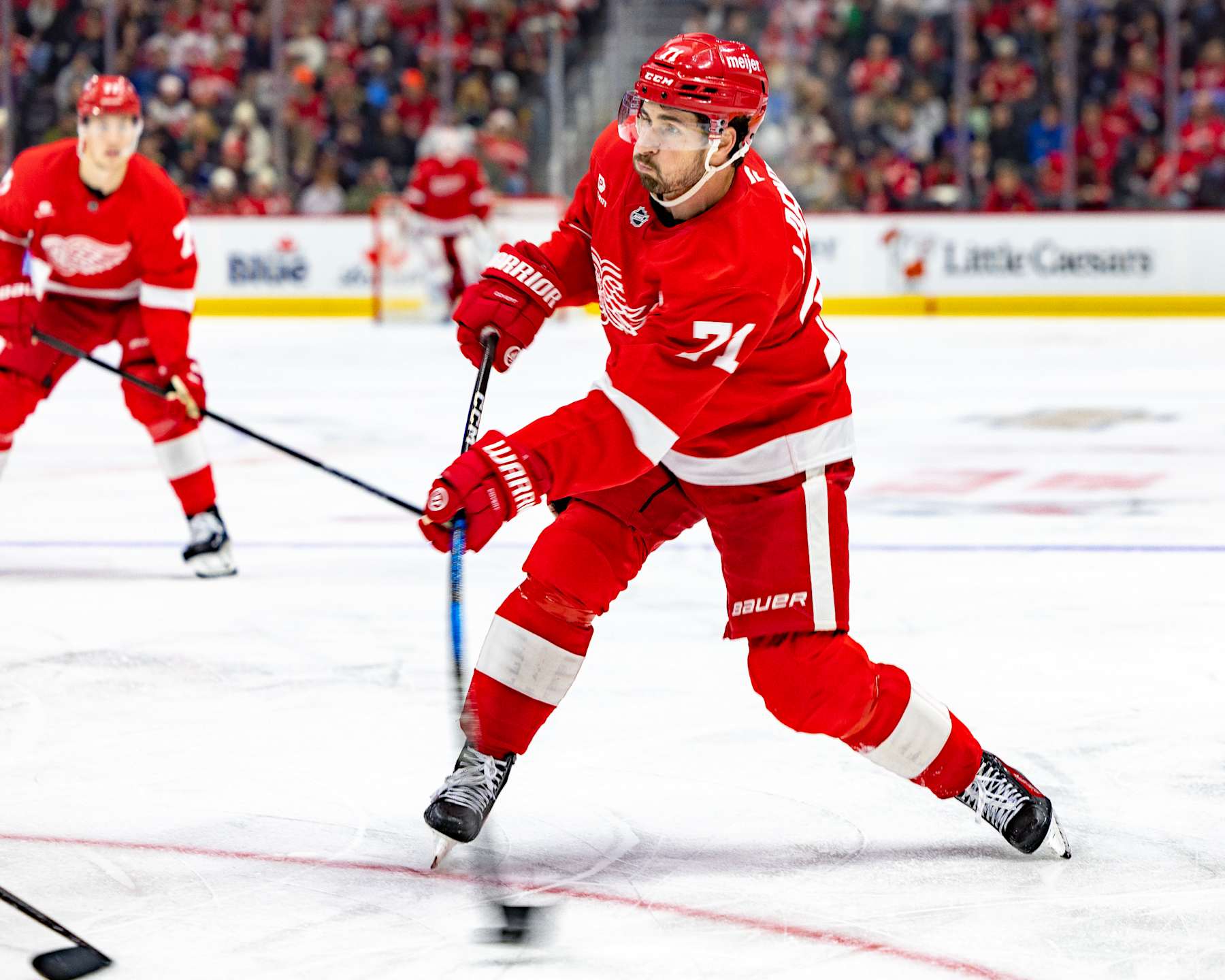 DETROIT, MICHIGAN - DECEMBER 01: Dylan Larkin #71 of the Detroit Red Wings shoots the puck against the Vancouver Canucks during the third period at Little Caesars Arena on December 1, 2024 in Detroit, Michigan. Vancouver defeated Detroit 5-4 in O.T. (Photo by Dave Reginek/NHLI via Getty Images)