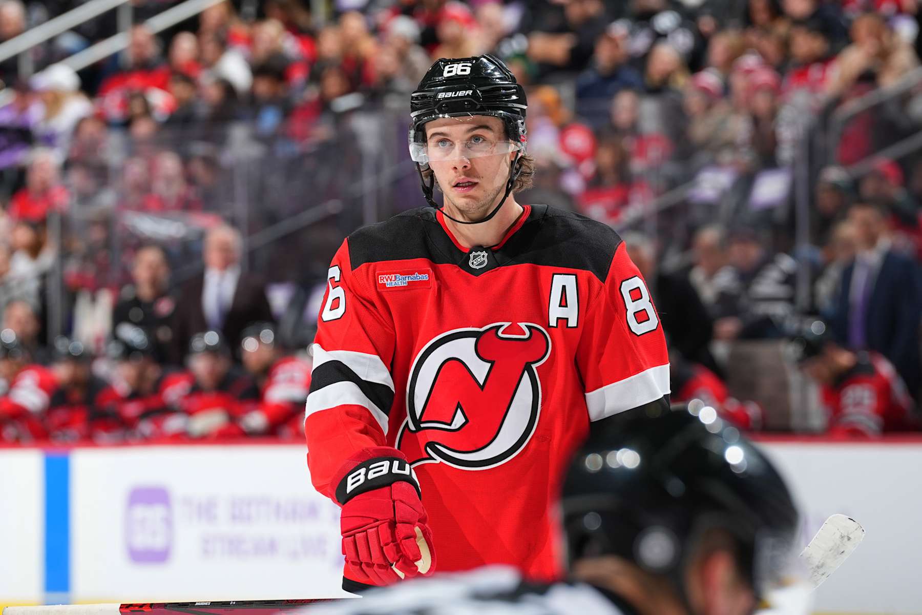 NEWARK, NJ - NOVEMBER 30: Jack Hughes #86 of the New Jersey Devils skates in the third period of the game against the Washington Capitals at the Prudential Center on November 30, 2024 in Newark, New Jersey. (Photo by Rich Graessle/NHLI via Getty Images)