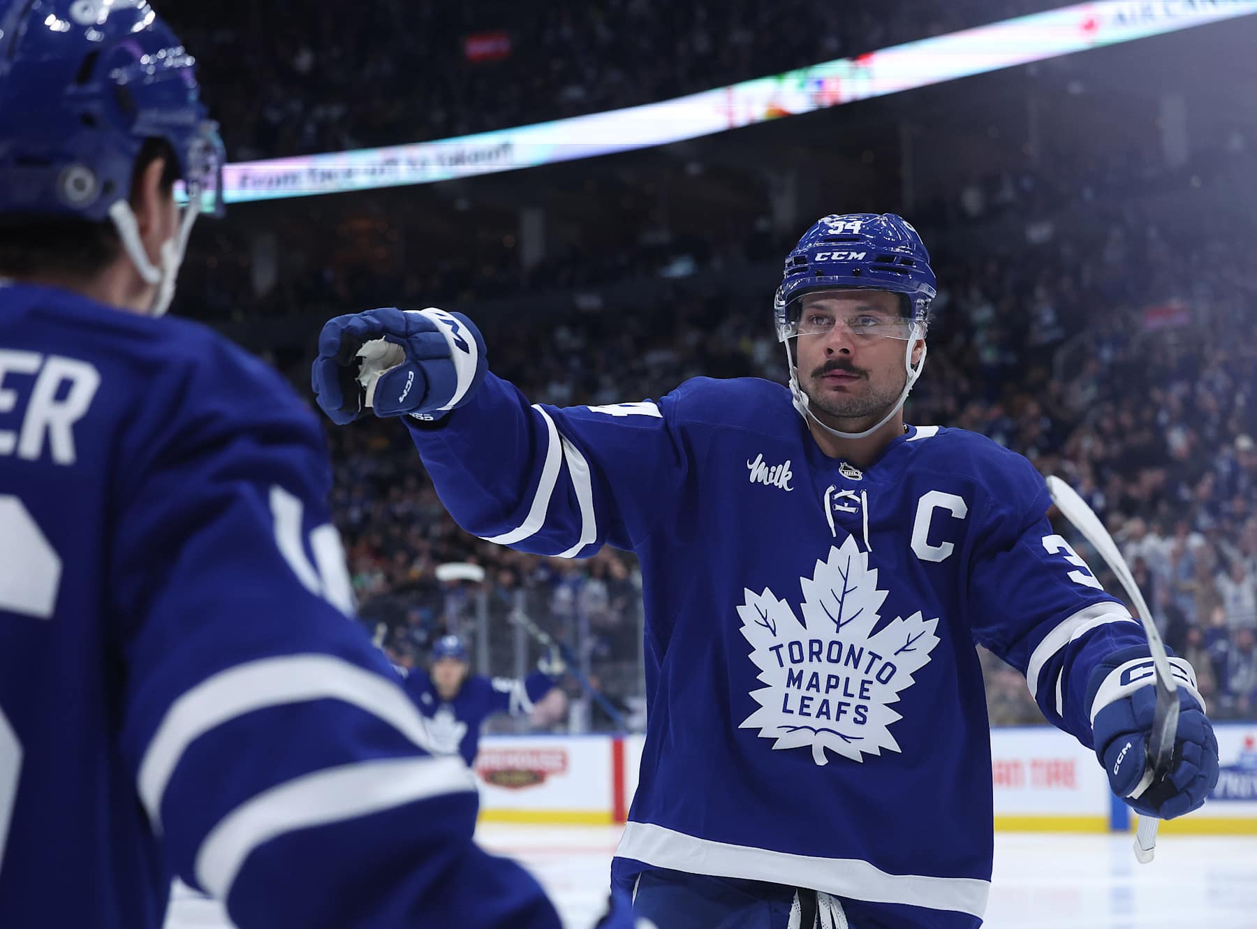 TORONTO, ON - DECEMBER 4 - Toronto Maple Leafs center Auston Matthews (34) gestures to Mitch Marner, who assisted on his first goal of the night in the third period as the Toronto Maple Leafs beat the Nashville Predators 3-2 at Scotiabank Arena in Toronto. December 4, 2024. (Photo by Steve Russell/Toronto Star via Getty Images)