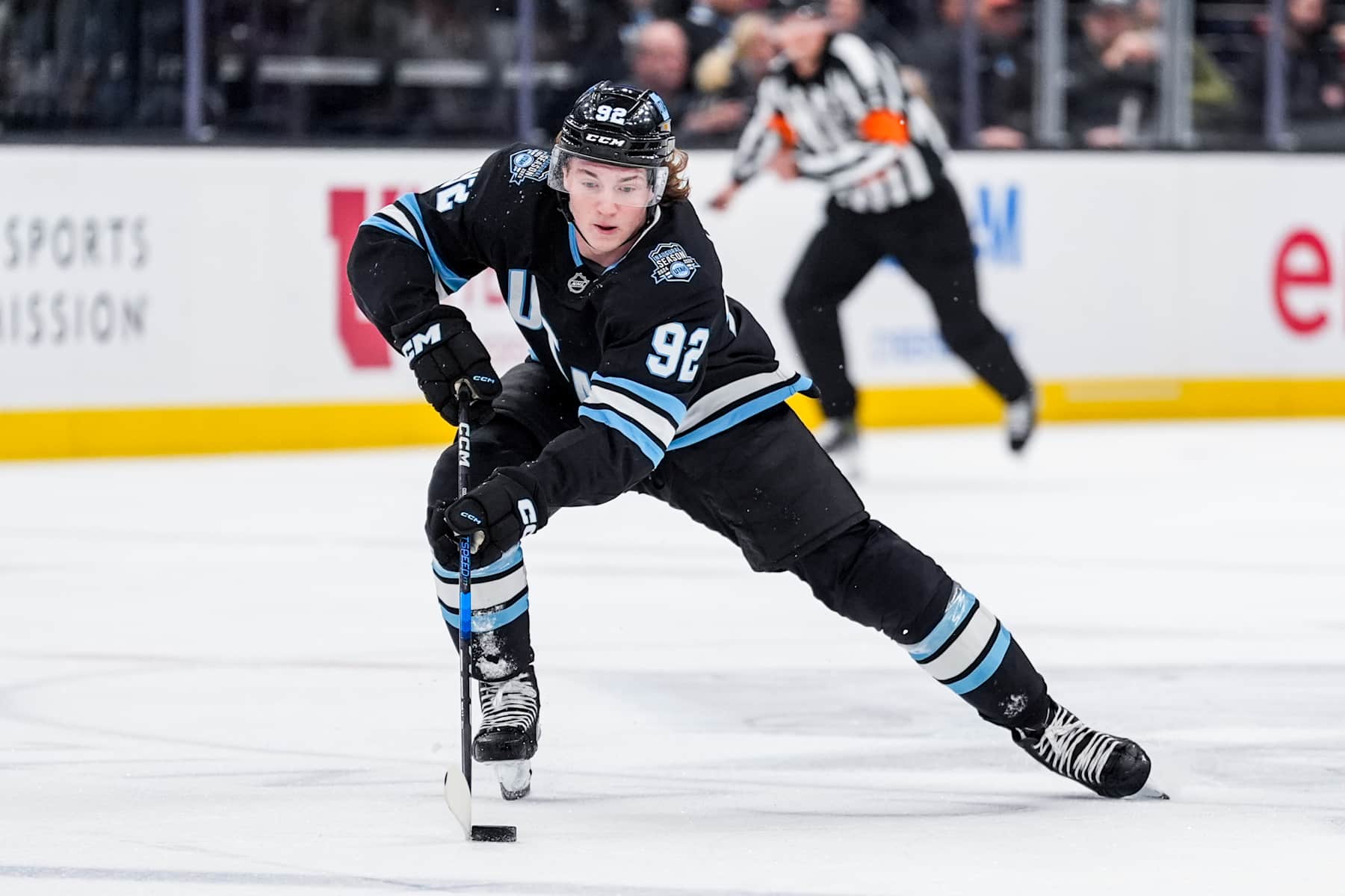 SALT LAKE CITY, UTAH - DECEMBER 2: Logan Cooley #92 of the Utah Hockey Club skates with the puck during the first period against the Dallas Stars on December 2, 2024 at Delta Center in Salt Lake City, Utah. (Photo by Hunter Dyke/NHLI via Getty Images)