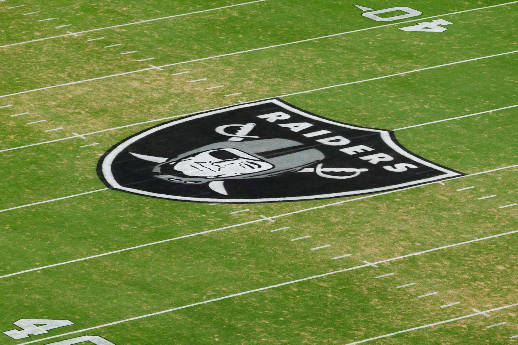 LAS VEGAS, NEVADA - AUGUST 23: A general view of a Las Vegas Raiders logo painted on the field before a preseason game against the San Francisco 49ers at Allegiant Stadium on August 23, 2024 in Las Vegas, Nevada. (Photo by Ric Tapia/Getty Images)