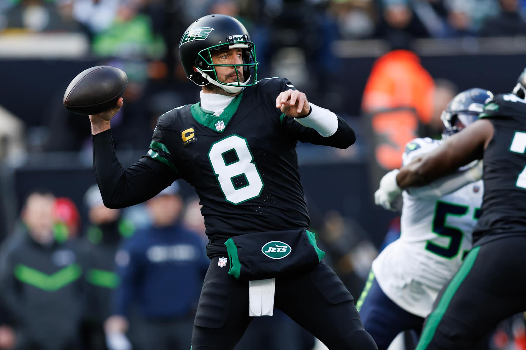 EAST RUTHERFORD, NEW JERSEY - DECEMBER 1: Quarterback Aaron Rodgers #8 of the New York Jets drops back to pass during the first half of an NFL football game against the Seattle Seahawks, at MetLife Stadium on December 1, 2024 in East Rutherford, New Jersey. (Photo by Brooke Sutton/Getty Images)
