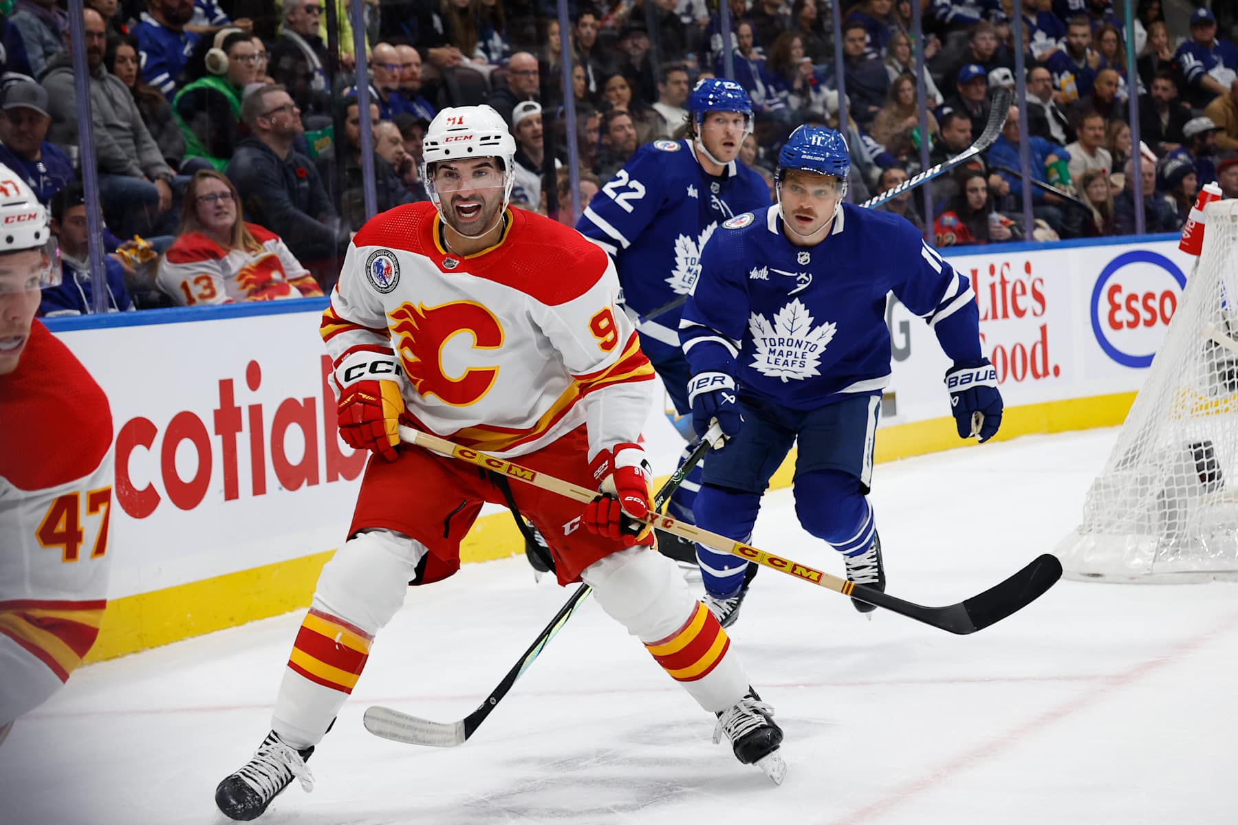 TORONTO.Ex Toronto Maple Leaf and current Calgary Flames player Nazem Kadri (91 white )yells for the puck as Max Domi of the Leafs gives chase (11 blue) in NHL action on Friday .(R.J.Johnston/Toronto Star)
(R.J. Johnston Toronto Star/Toronto Star via Getty Images)