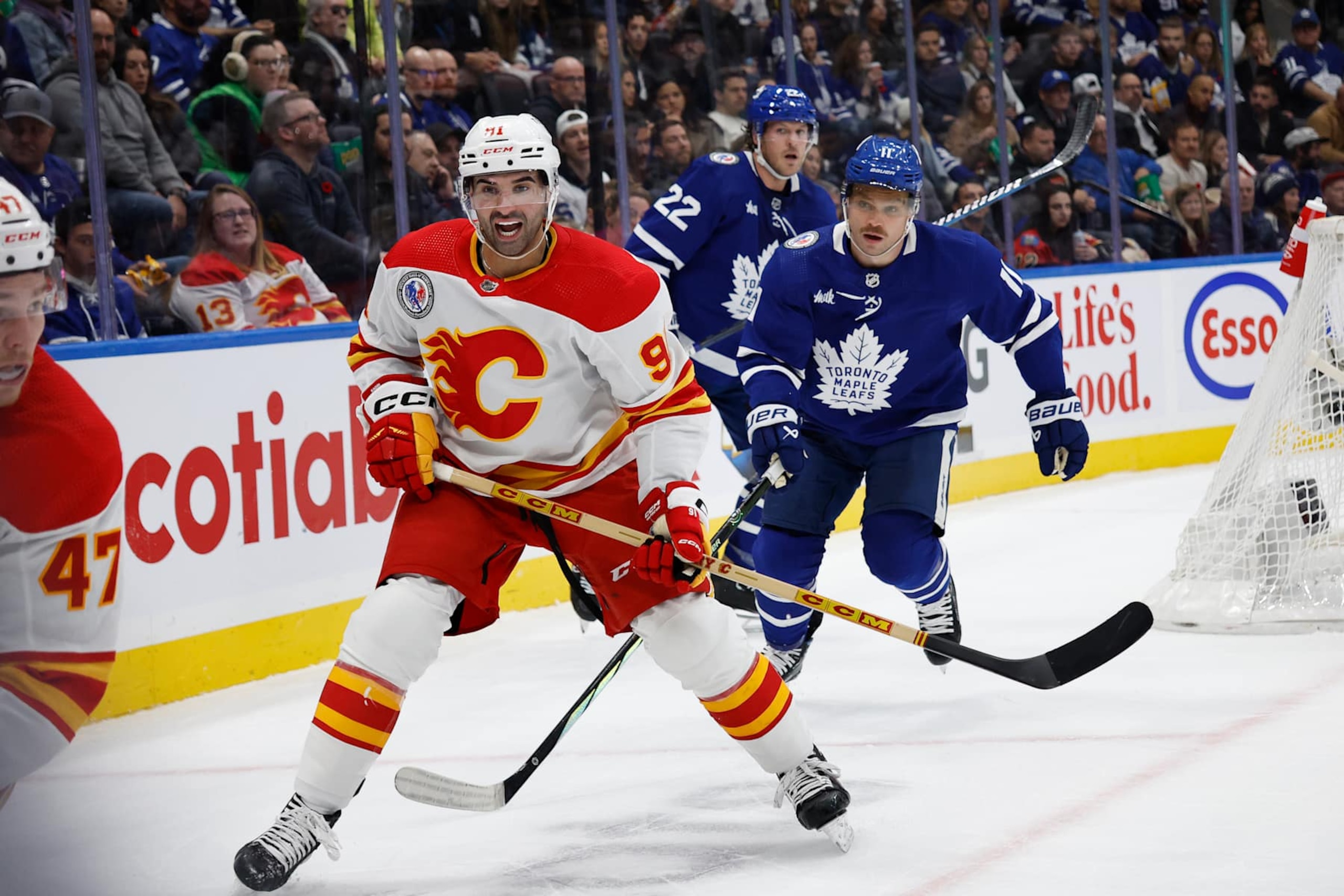 TORONTO.Ex Toronto Maple Leaf and current Calgary Flames player Nazem Kadri (91 white )yells for the puck as Max Domi of the Leafs gives chase (11 blue) in NHL action on Friday .(R.J.Johnston/Toronto Star)
(R.J. Johnston Toronto Star/Toronto Star via Getty Images) TORONTO.Ex Toronto Maple Leaf and current Calgary Flames player Nazem Kadri (91 white )yells for the puck as Max Domi of the Leafs gives chase (11 blue) in NHL action on Friday .(R.J.Johnston/Toronto Star)
(R.J. Johnston Toronto Star/Toronto Star via Getty Images)