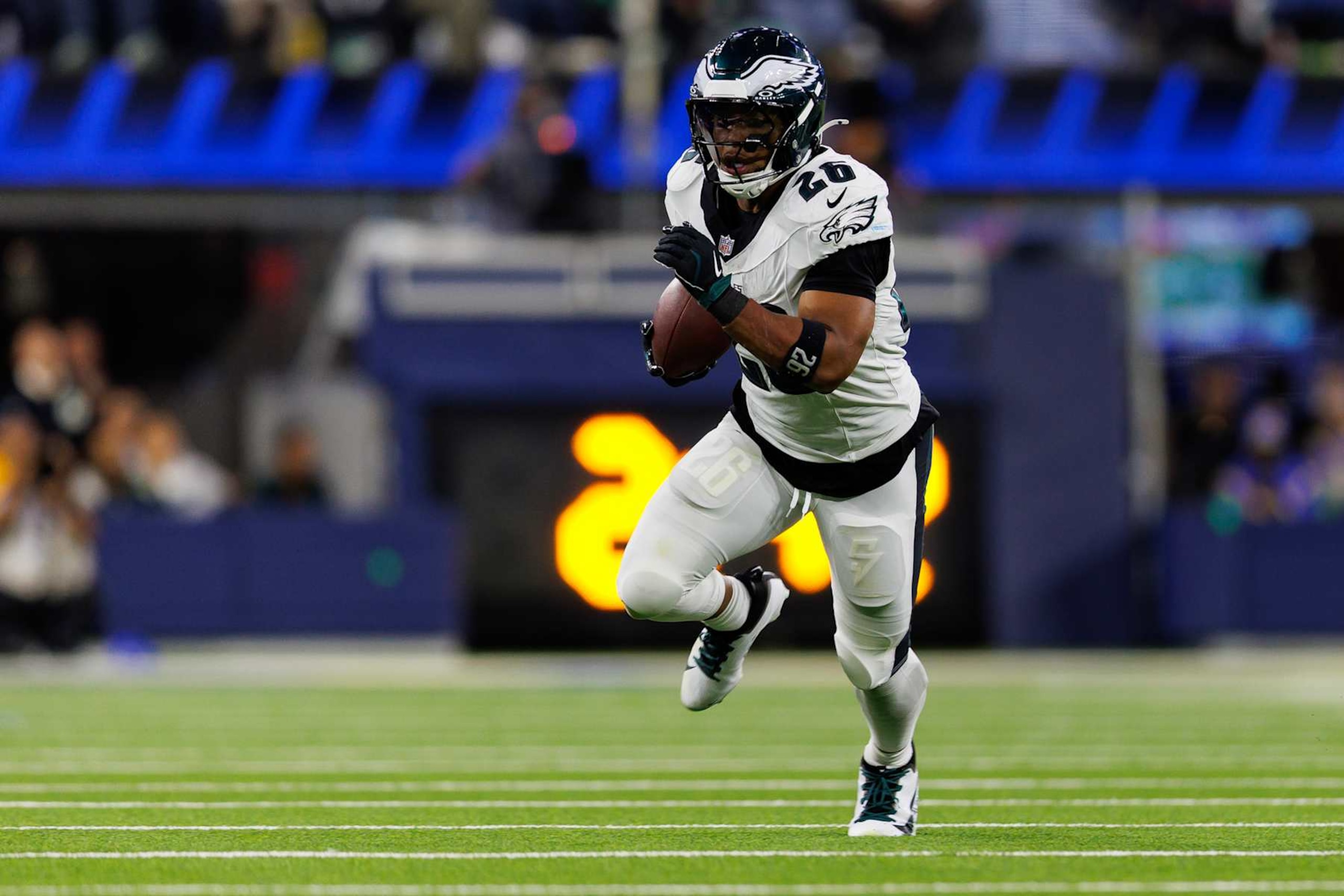 INGLEWOOD, CALIFORNIA - NOVEMBER 24: Running back Saquon Barkley #26 of the Philadelphia Eagles carries the ball during an NFL football game against the Los Angeles Rams, at SoFi Stadium on November 24, 2024 in Inglewood, California. (Photo by Brooke Sutton/Getty Images)