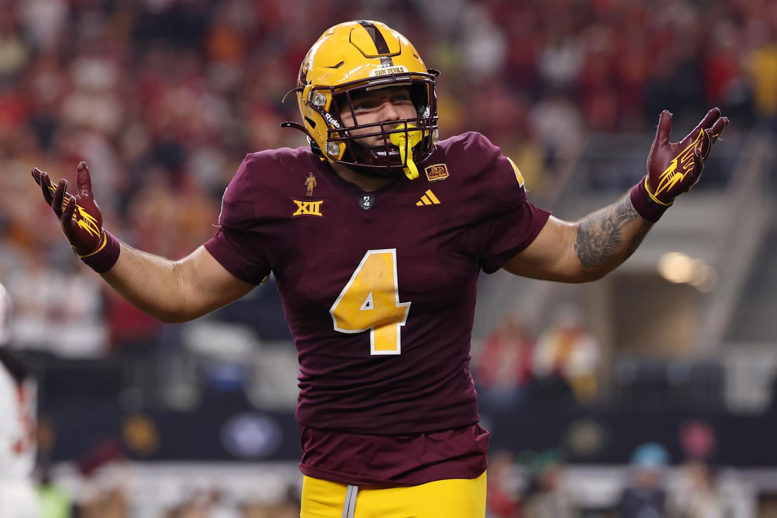 ARLINGTON, TEXAS - DECEMBER 07: Cam Skattebo #4 of the Arizona State Sun Devils celebrates after his rushing touchdown against the Iowa State Cyclones during the second quarter of the Big 12 Championship game at AT&T Stadium on December 07, 2024 in Arlington, Texas. (Photo by Sam Hodde/Getty Images) ARLINGTON, TEXAS - DECEMBER 07: Cam Skattebo #4 of the Arizona State Sun Devils celebrates after his rushing touchdown against the Iowa State Cyclones during the second quarter of the Big 12 Championship game at AT&T Stadium on December 07, 2024 in Arlington, Texas. (Photo by Sam Hodde/Getty Images)