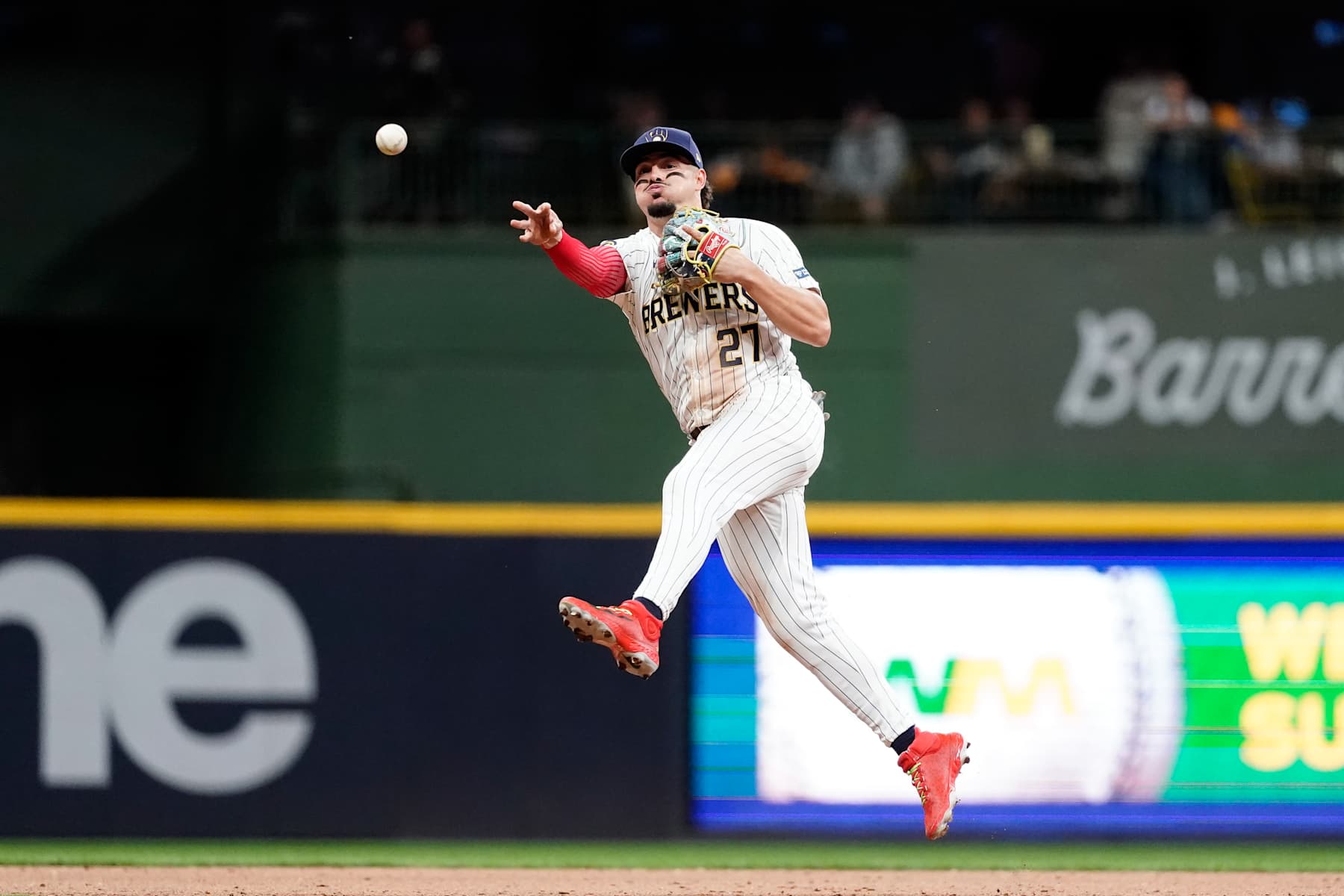MILWAUKEE, WI - OCTOBER 02: Willy Adames #27 of the Milwaukee Brewers throws the ball to first base in the seventh inning during Game 2 of the Wild Card Series presented by T-Mobile 5G Home Internet between the New York Mets and the Milwaukee Brewers at American Family Field on Wednesday, October 2, 2024 in Milwaukee, Wisconsin. (Photo by Aaron Gash/MLB Photos via Getty Images)