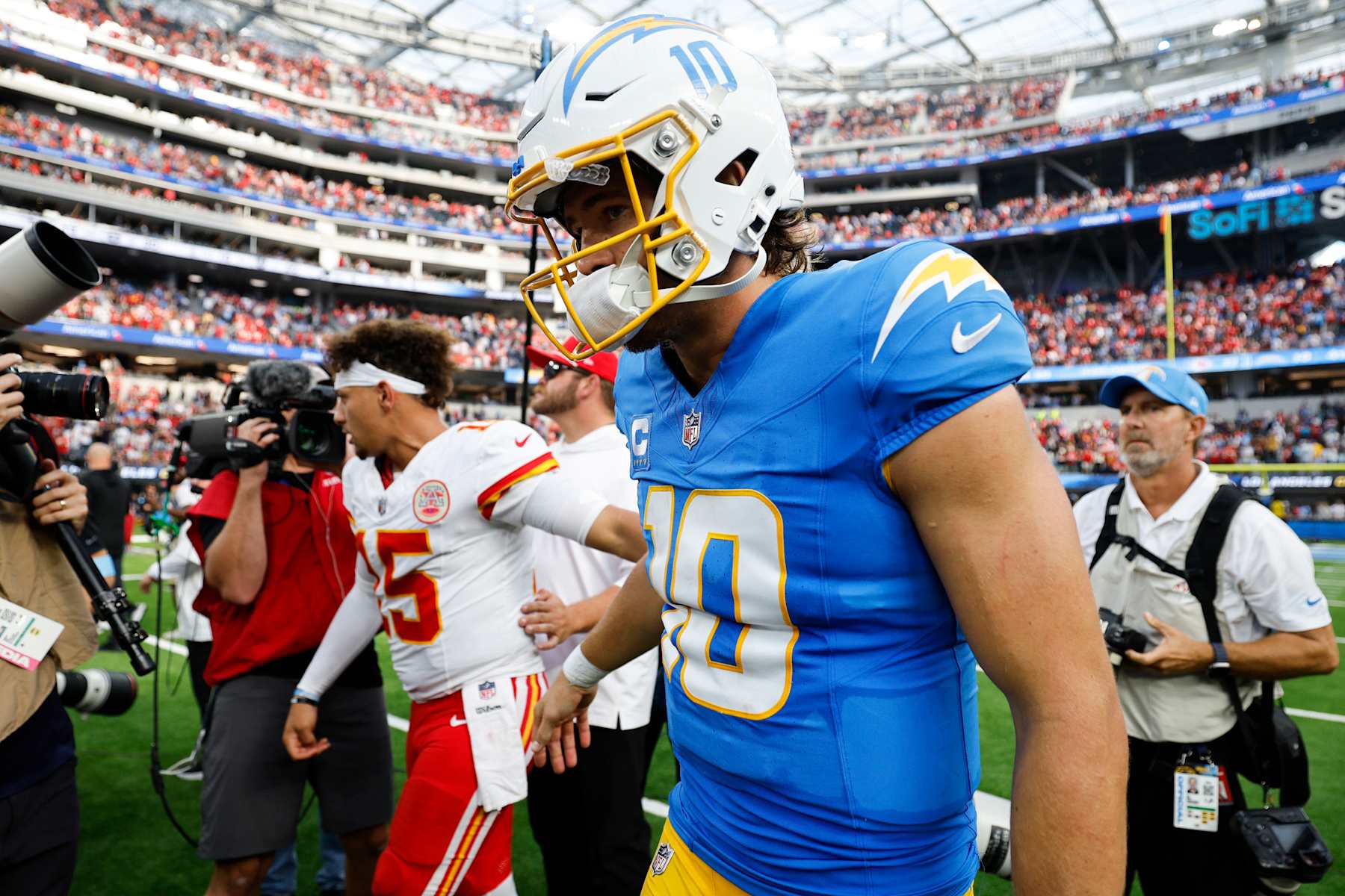 INGLEWOOD, CALIFORNIA - SEPTEMBER 29: Patrick Mahomes #15 of the Kansas City Chiefs and Justin Herbert #10 of the Los Angeles Chargers shake hands following the game at SoFi Stadium on September 29, 2024 in Inglewood, California. (Photo by Kevork Djansezian/Getty Images)