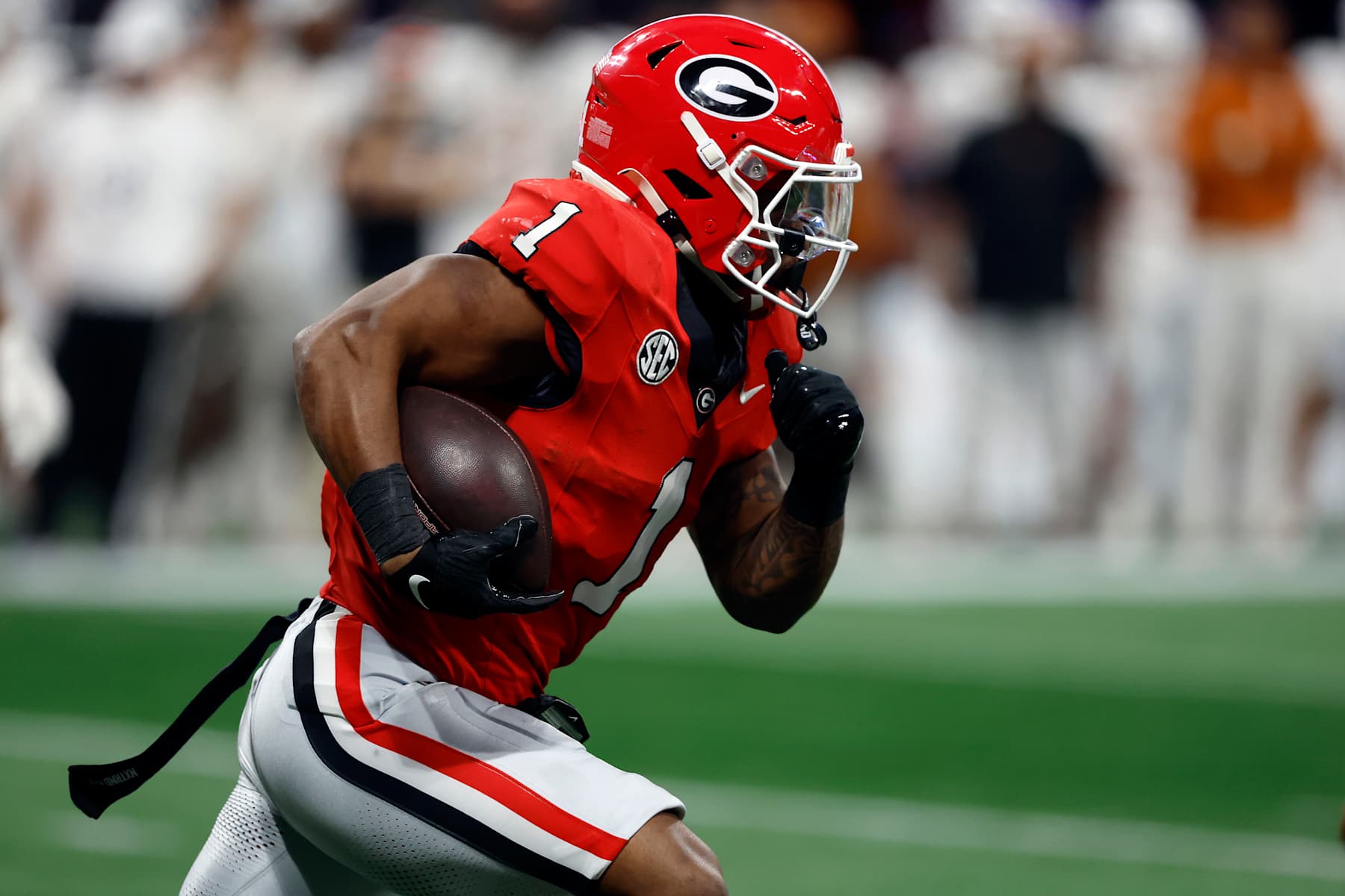 ATLANTA, GEORGIA - DECEMBER 07: Trevor Etienne #1 of the Georgia Bulldogs runs the ball against the Texas Longhorns during the third quarter of the 2024 SEC Championship at Mercedes-Benz Stadium on December 07, 2024 in Atlanta, Georgia. (Photo by Butch Dill/Getty Images)