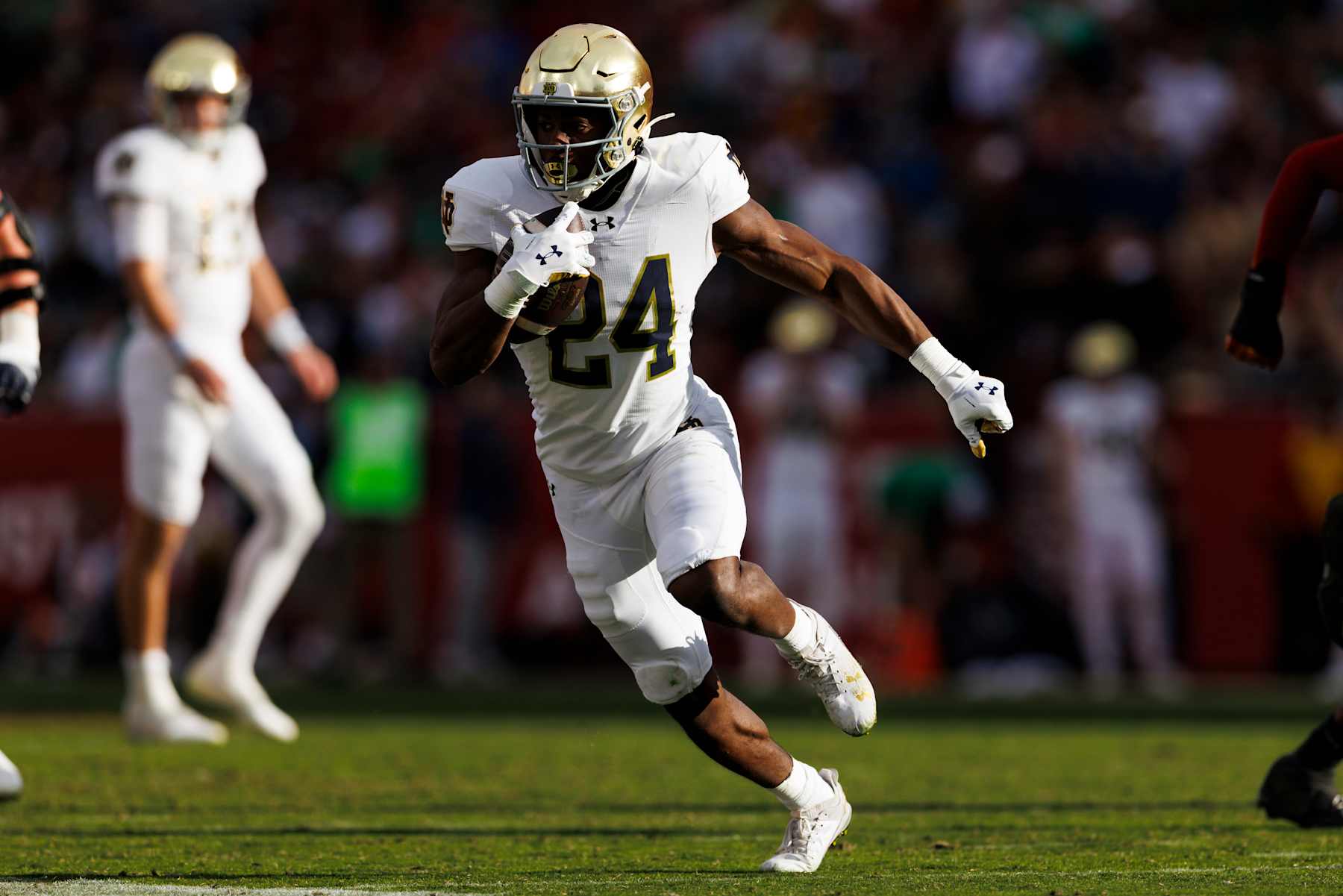 LOS ANGELES, CALIFORNIA - NOVEMBER 30: Jadarian Price #24 of the Notre Dame Fighting Irish runs with the ball during the second half against USC Trojans at United Airlines Field at the Los Angeles Memorial Coliseum on November 30, 2024 in Los Angeles, California. (Photo by Ric Tapia/Getty Images)