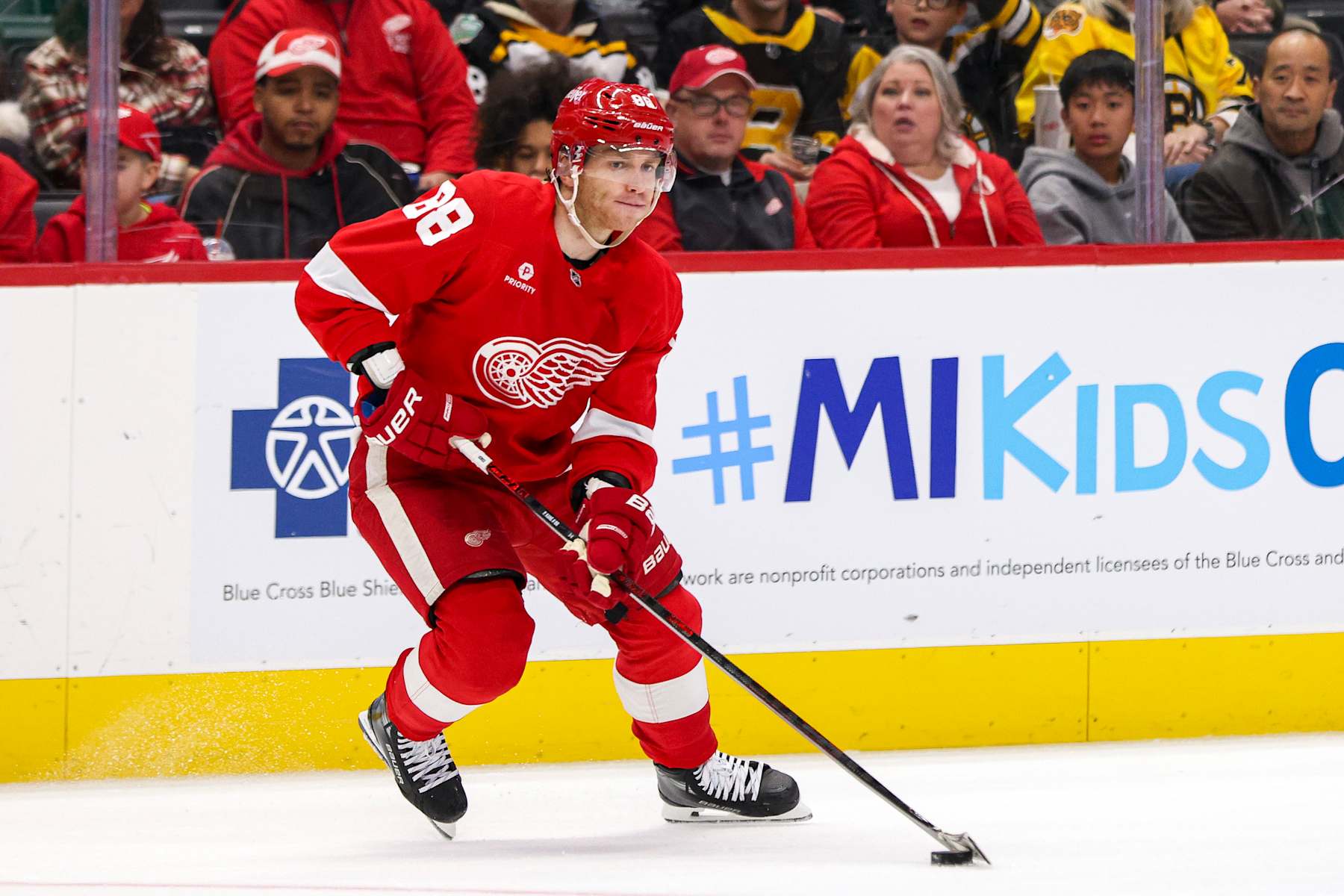 DETROIT, MICHIGAN - NOVEMBER 23: Patrick Kane #88 of the Detroit Red Wings skates the puck up the ice during the second period of a game against the Boston Bruins at Little Caesars Arena on November 23, 2024 in Detroit, Michigan. (Photo by Mike Mulholland/Getty Images)
