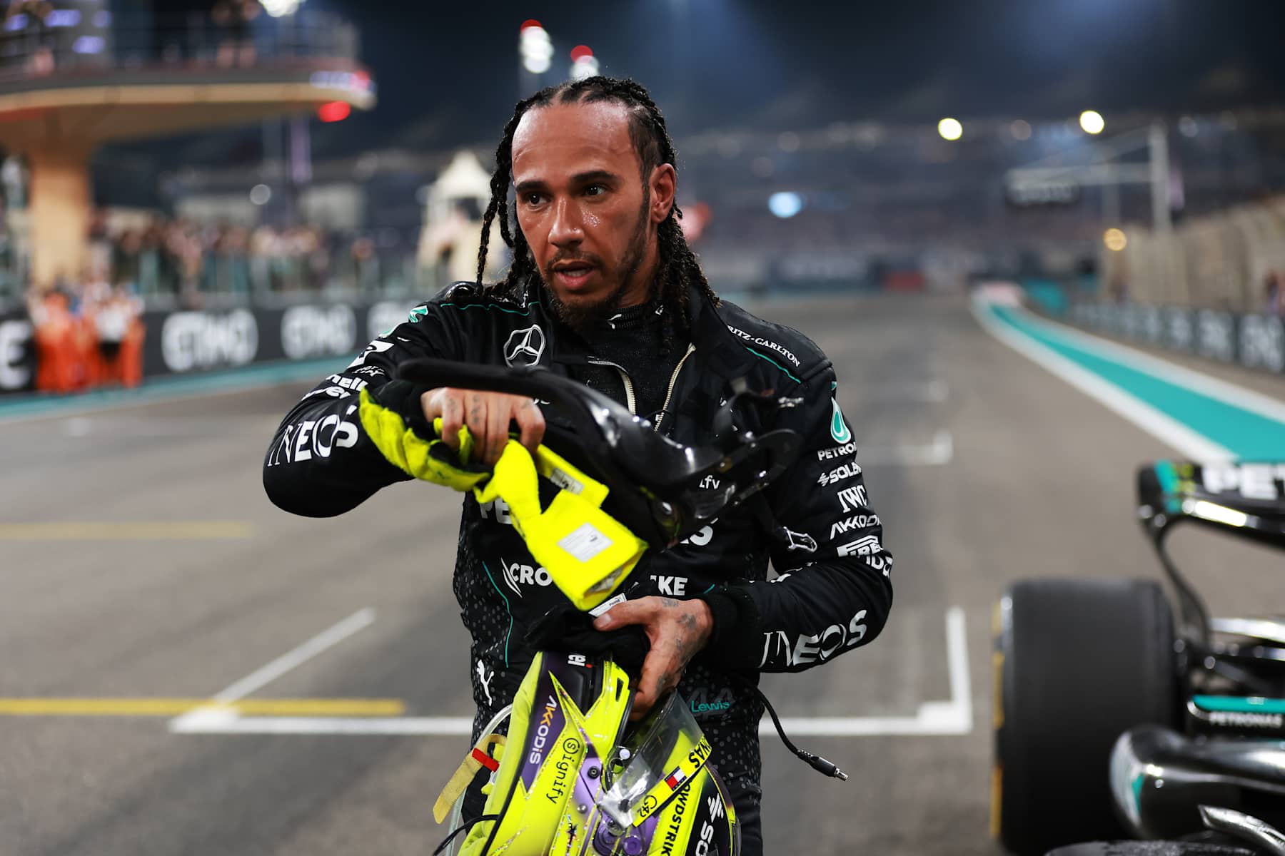ABU DHABI, UNITED ARAB EMIRATES - DECEMBER 08: 4th placed Lewis Hamilton of Great Britain and Mercedes reacts after performing donuts on track for his final race with Mercedes during the F1 Grand Prix of Abu Dhabi at Yas Marina Circuit on December 08, 2024 in Abu Dhabi, United Arab Emirates. (Photo by Bryn Lennon - Formula 1/Formula 1 via Getty Images)