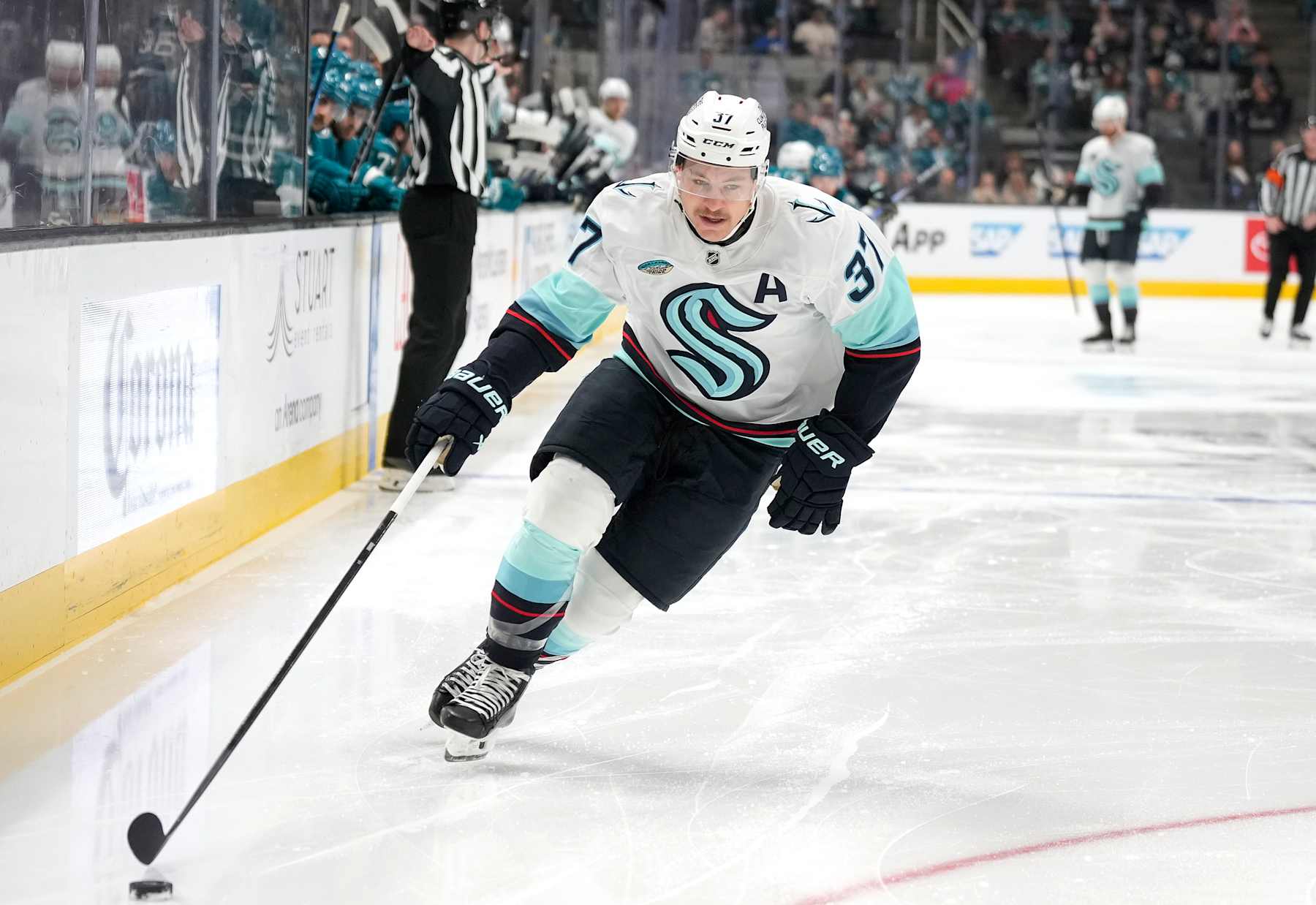 SAN JOSE, CALIFORNIA - NOVEMBER 29: Yanni Gourde #37 of the Seattle Kraken skates with control of the puck against the San Jose Sharks during the first period of an NHL hockey game at SAP Center on November 29, 2024 in San Jose, California. (Photo by Thearon W. Henderson/Getty Images)