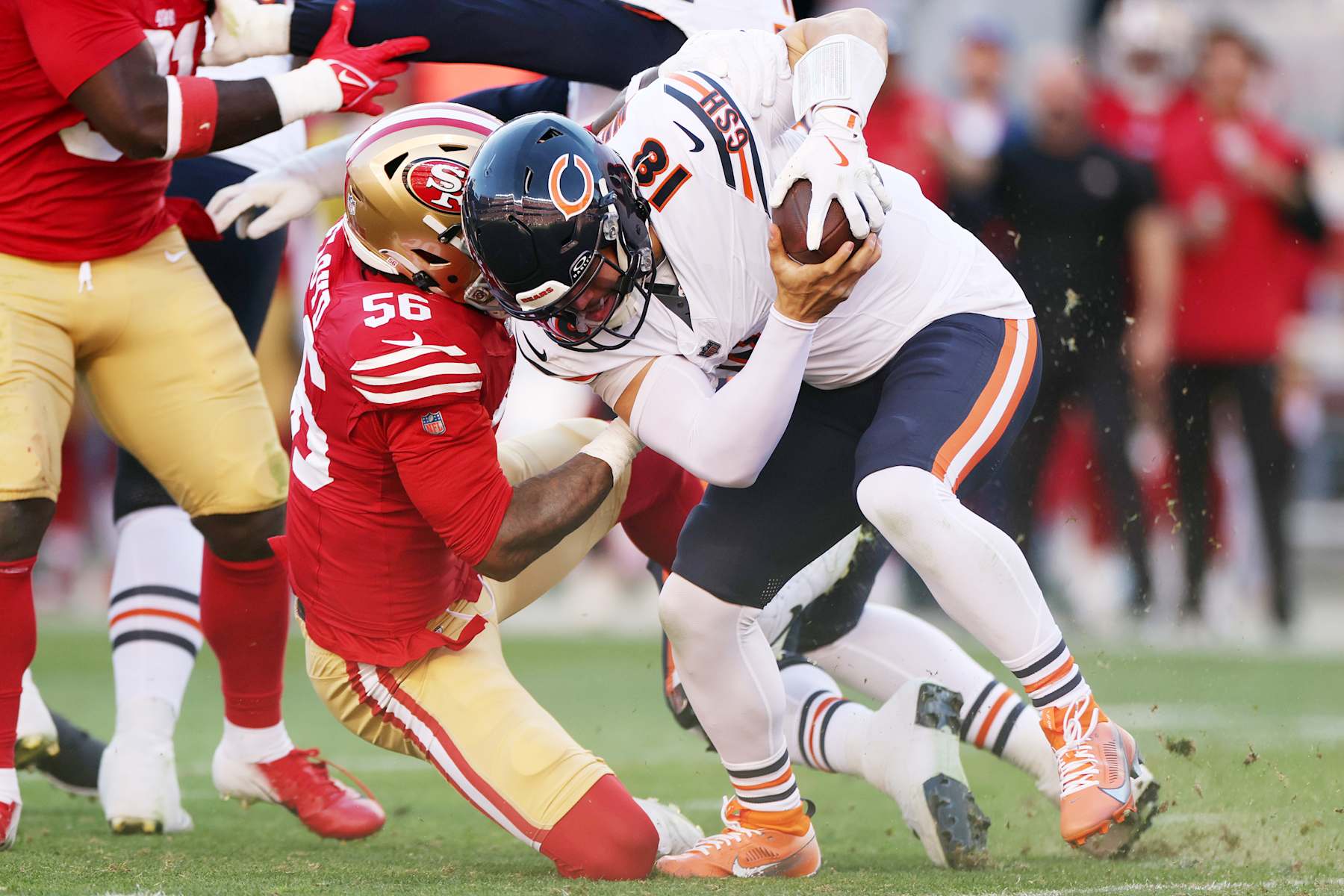SANTA CLARA, CALIFORNIA - DECEMBER 08: Leonard Floyd #56 of the San Francisco 49ers sacks Caleb Williams #18 of the Chicago Bears during the first quarter at Levi's Stadium on December 08, 2024 in Santa Clara, California. (Photo by Ezra Shaw/Getty Images)