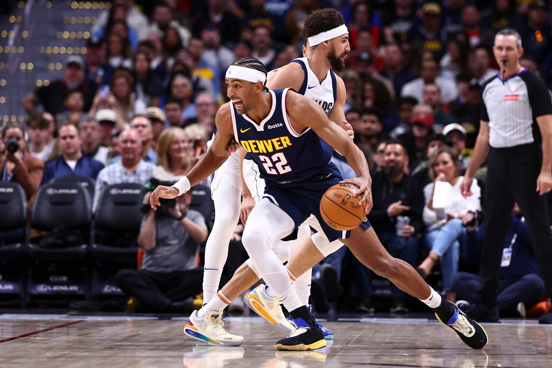 DENVER, COLORADO - NOVEMBER 10: Zeke Nnaji #22 of the Denver Nuggets dribbles the ball past Klay Thompson #31 of the Dallas Mavericks in the first half at Ball Arena on November 10, 2024 in Denver, Colorado. NOTE TO USER: User expressly acknowledges and agrees that, by downloading and or using this photograph, user is consenting to the terms and conditions of the Getty Images License Agreement. (Photo by Tyler Schank/Clarkson Creative/Getty Images)