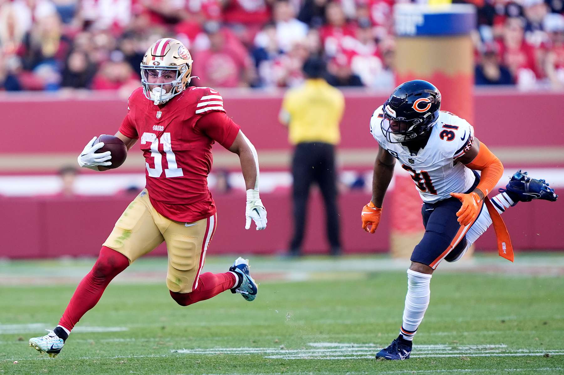 SANTA CLARA, CALIFORNIA - DECEMBER 08: Isaac Guerendo #31 of the San Francisco 49ers runs with the ball as Kevin Byard III #31 of the Chicago Bears defends during the second quarter at Levi's Stadium on December 08, 2024 in Santa Clara, California. (Photo by Thearon W. Henderson/Getty Images)
