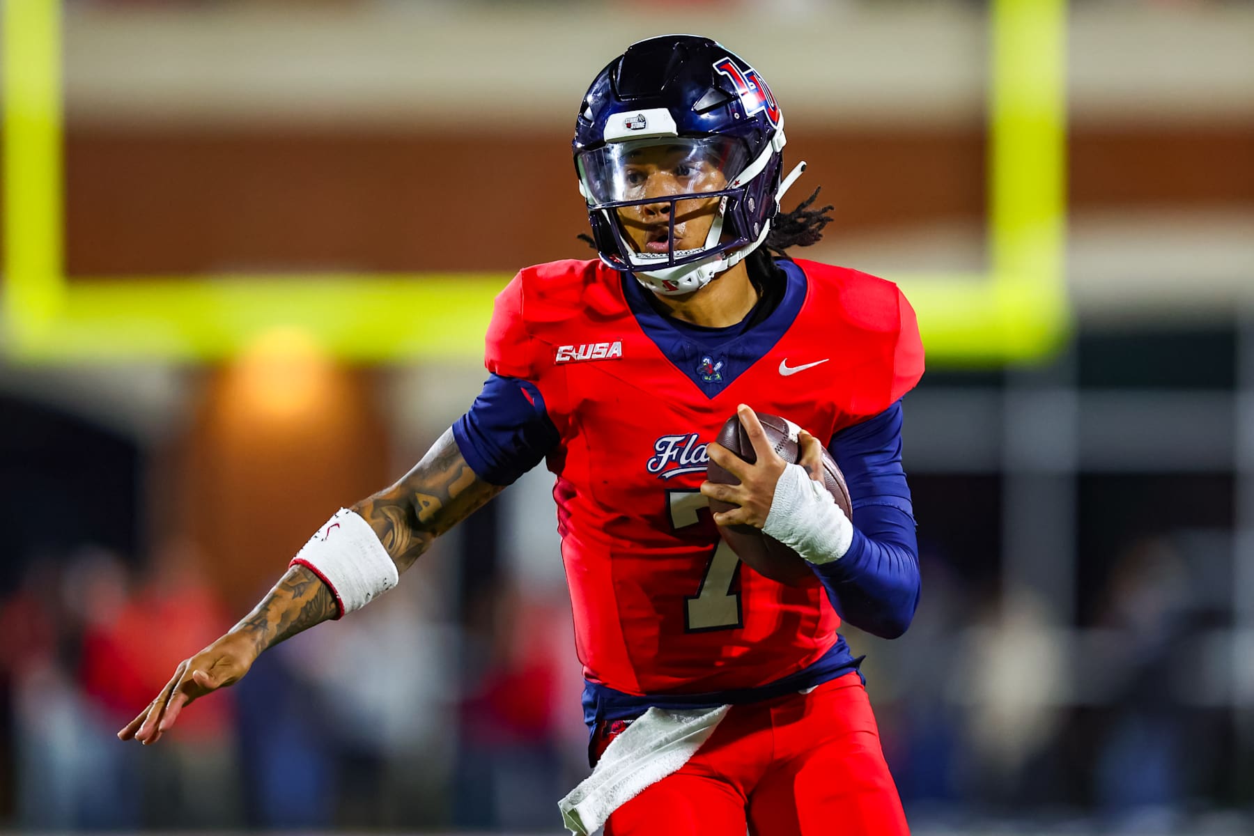 LYNCHBURG, VIRGINIA - OCTOBER 30: Kaidon Salter #7 of the Liberty Flames runs the ball during the first half of a football game against the Jacksonville State Gamecocks at Williams Stadium on October 30, 2024 in Lynchburg, Virginia.  (Photo by David Jensen/Getty Images)