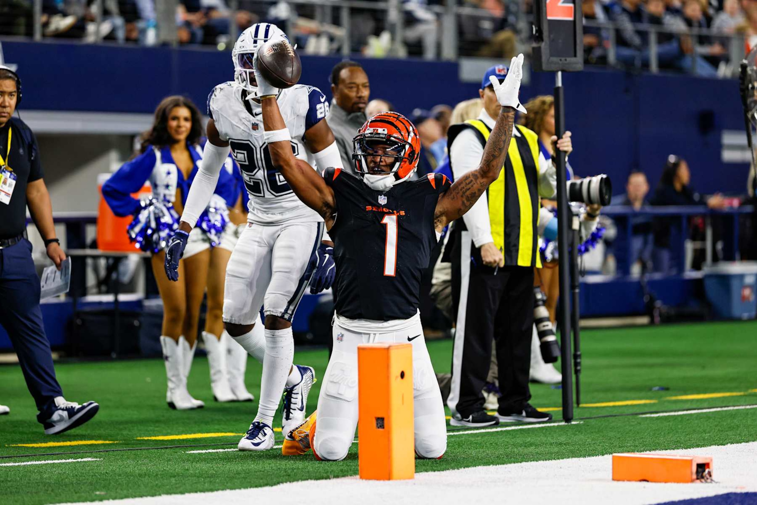 ARLINGTON, TX - DECEMBER 09: Cincinnati Bengals wide receiver Ja'Marr Chase (1) scores a touchdown over Dallas Cowboys cornerback DaRon Bland (26) during the game between the Dallas Cowboys and the Cincinnati Bengals on December 9, 2024 at AT&T Stadium in Arlington, Texas. (Photo by Matthew Pearce/Icon Sportswire via Getty Images)