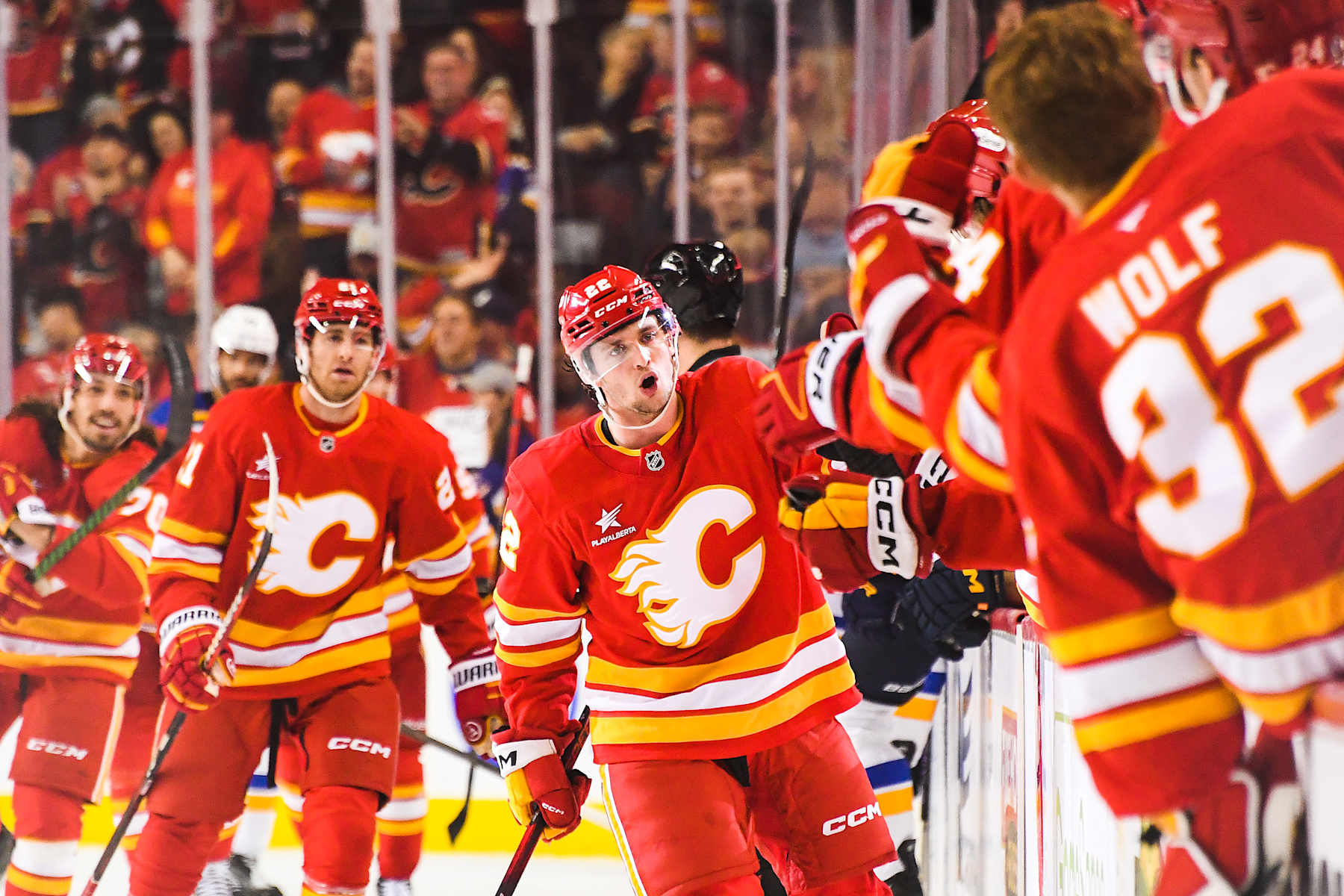 CALGARY, CANADA - DECEMBER 5: Jakob Pelletier #22 of the Calgary Flames celebrates with the bench after scoring against the St Louis Blues during the first period of an NHL game at Scotiabank Saddledome on December 5, 2024 in Calgary, Alberta, Canada. (Photo by Derek Leung/Getty Images)