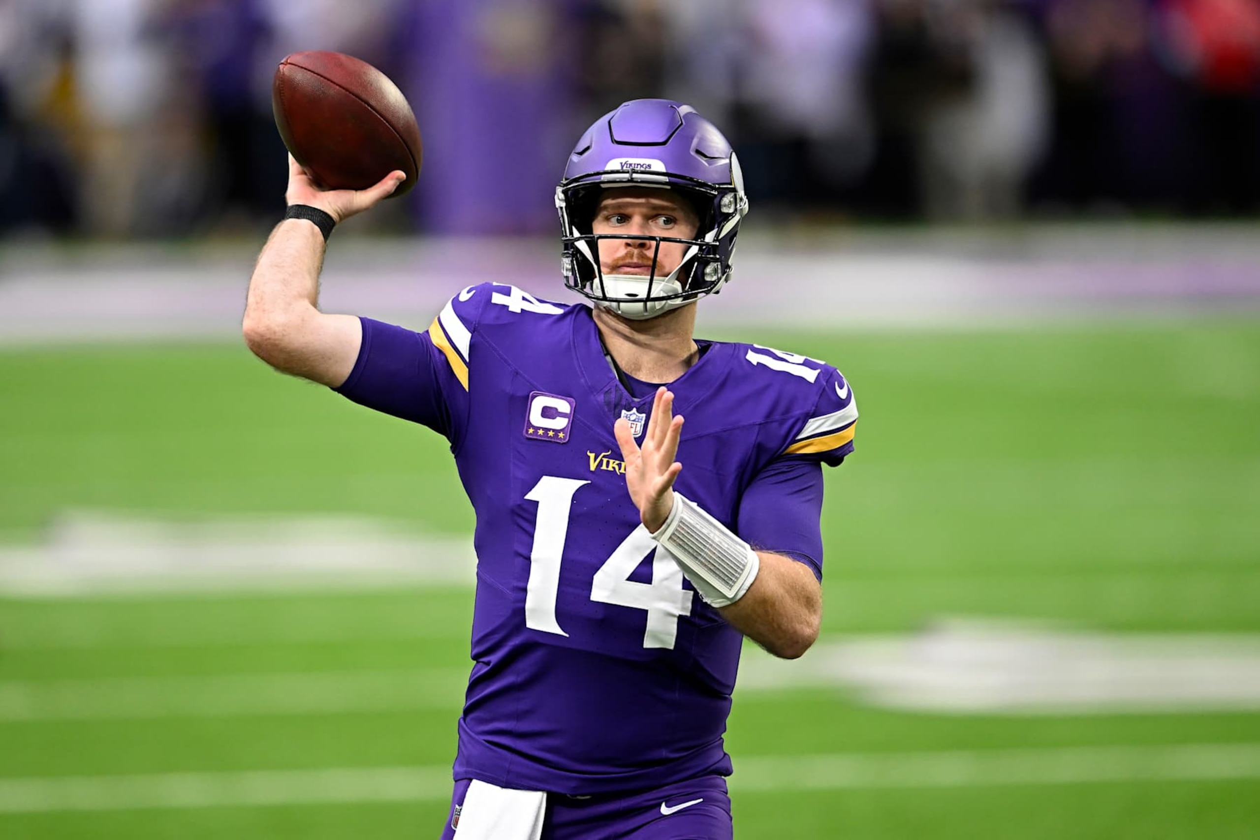MINNEAPOLIS, MINNESOTA - DECEMBER 08: Sam Darnold #14 of the Minnesota Vikings warms up before the game against the Atlanta Falcons at U.S. Bank Stadium on December 08, 2024 in Minneapolis, Minnesota. (Photo by Stephen Maturen/Getty Images)