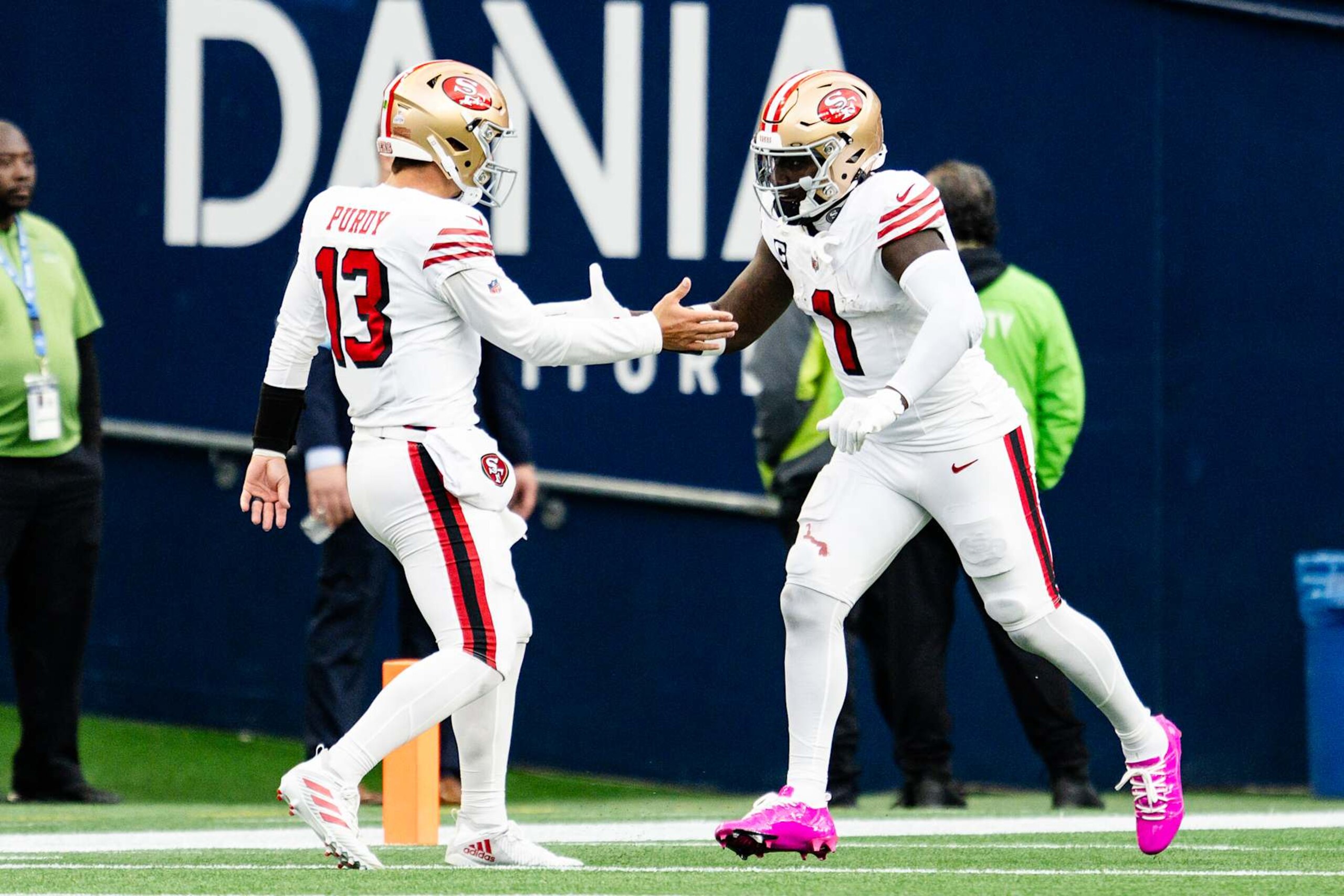 SEATTLE, WASHINGTON - OCTOBER 10: Deebo Samuel Sr. #1 and Brock Purdy #13 of the San Francisco 49ers celebrate together during the second quarter of the game against the Seattle Seahawks at Lumen Field on October 10, 2024 in Seattle, Washington. (Photo by Jane Gershovich/Getty Images)