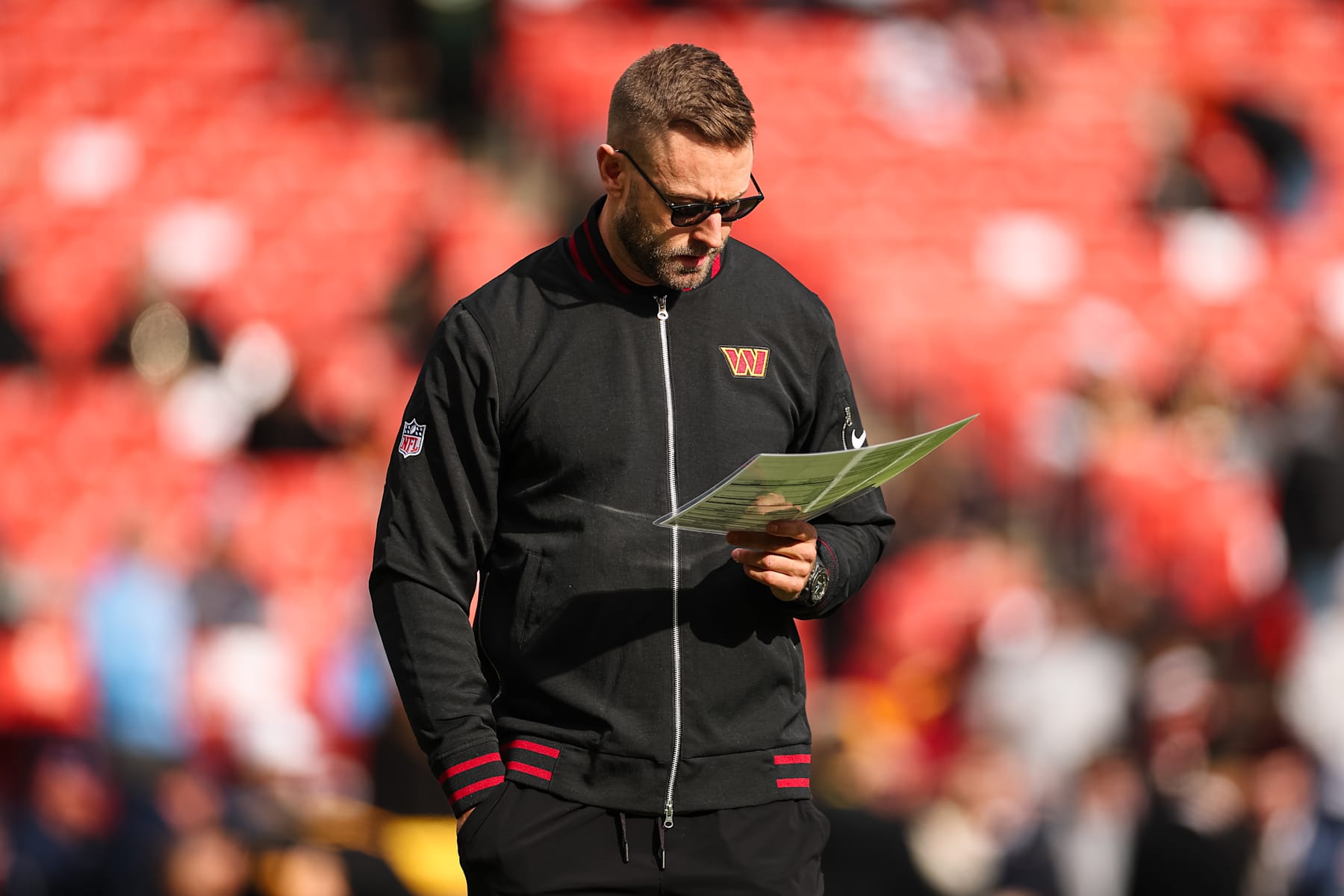 LANDOVER, MD - DECEMBER 01: Offensive coordinator Kliff Kingsbury of the Washington Commanders looks on before the game against the Tennessee Titans at Northwest Stadium on December 1, 2024 in Landover, Maryland. (Photo by Scott Taetsch/Getty Images)