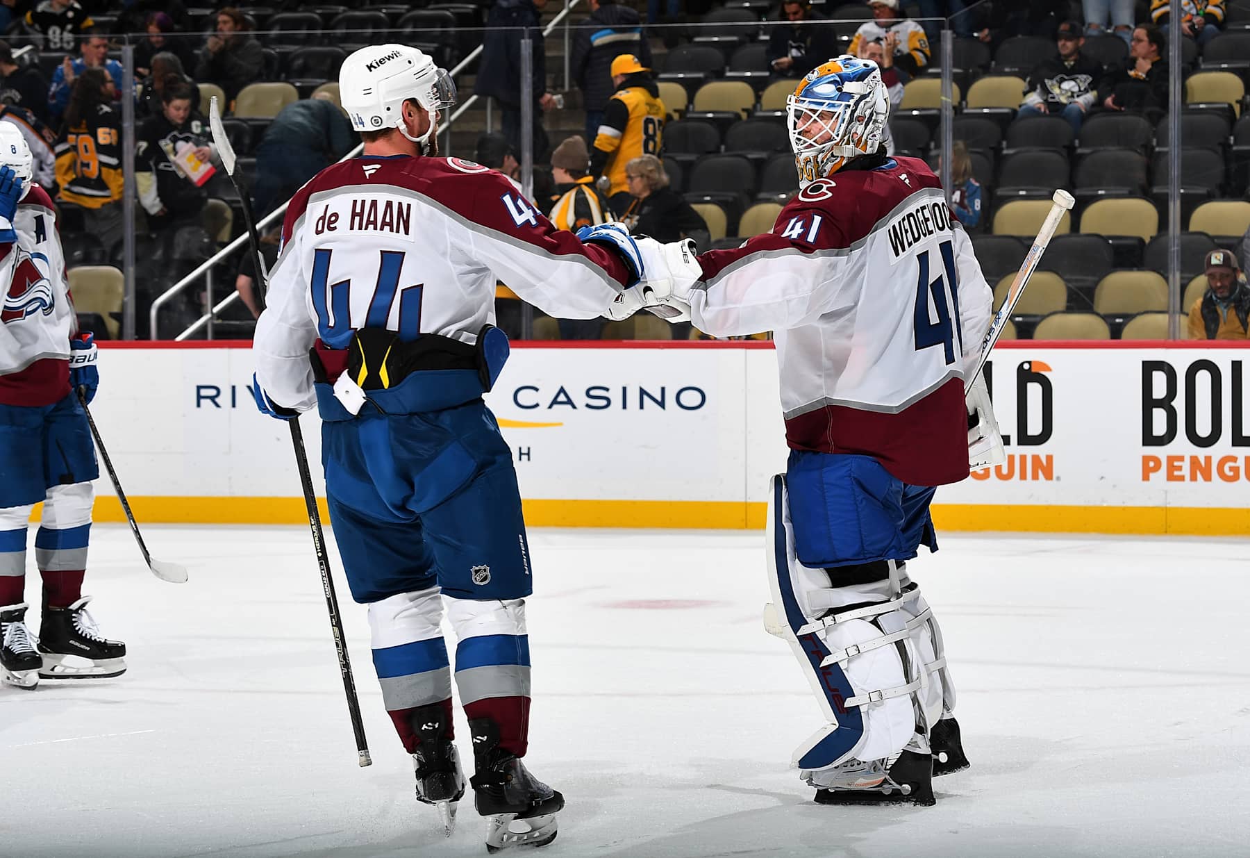 PITTSBURGH, PA - DECEMBER 10: Scott Wedgewood #41 celebrates with Calvin de Haan #44 of the Colorado Avalanche after a 6-2 win over the Pittsburgh Penguins at PPG PAINTS Arena on December 10, 2024 in Pittsburgh, Pennsylvania. (Photo by Joe Sargent/NHLI via Getty Images)
