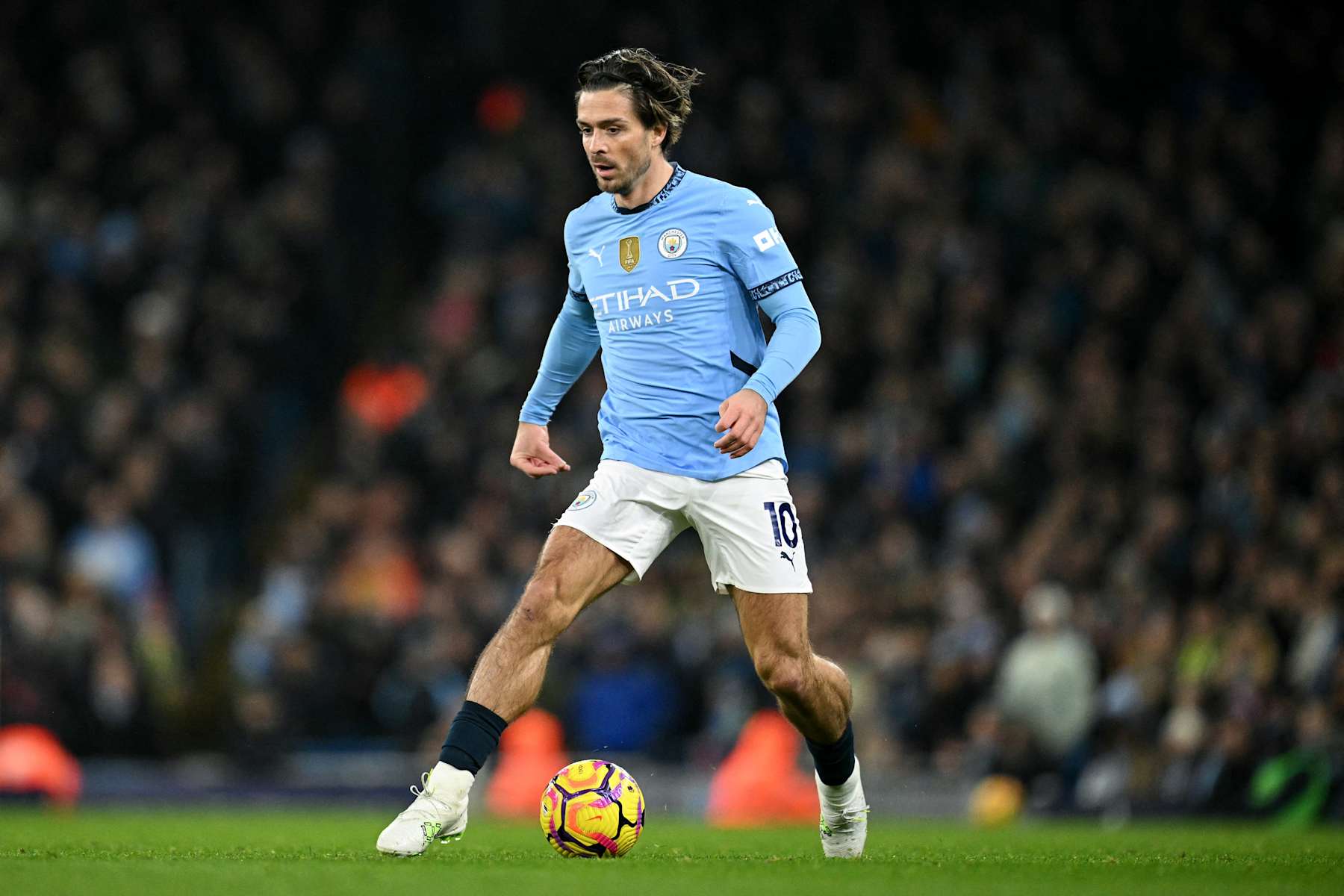 Manchester City's English midfielder #10 Jack Grealish runs with the ball during the English Premier League football match between Manchester City and Nottingham Forest at the Etihad Stadium in Manchester, north west England, on December 4, 2024. (Photo by Oli SCARFF / AFP) / RESTRICTED TO EDITORIAL USE. No use with unauthorized audio, video, data, fixture lists, club/league logos or 'live' services. Online in-match use limited to 120 images. An additional 40 images may be used in extra time. No video emulation. Social media in-match use limited to 120 images. An additional 40 images may be used in extra time. No use in betting publications, games or single club/league/player publications. / (Photo by OLI SCARFF/AFP via Getty Images)