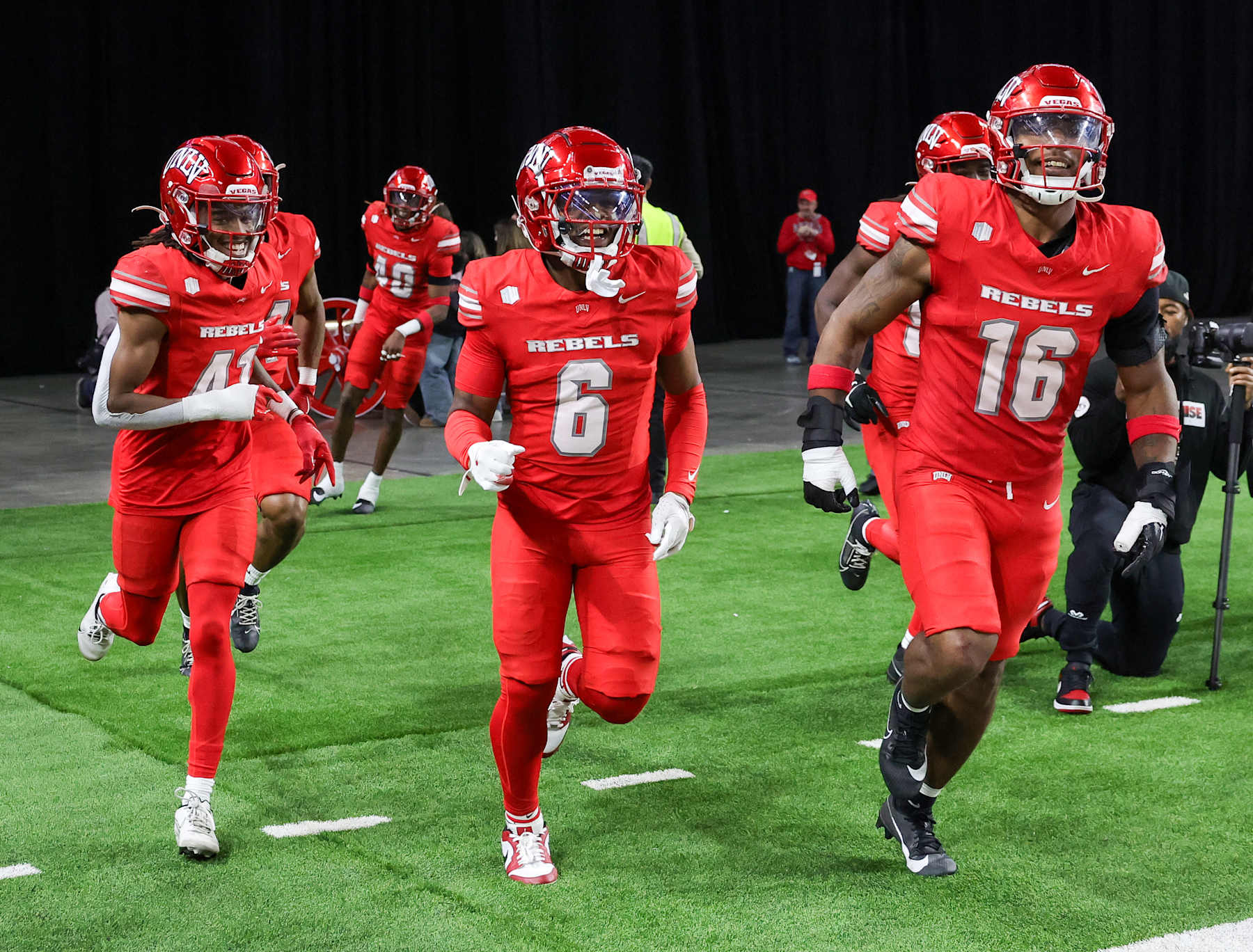 LAS VEGAS, NEVADA - NOVEMBER 30: Defensive backs Rashod Tanner #41 and Jeremiah Vessel #6 and linebacker Mani Powell #16 of the UNLV Rebels run back to the sideline after covering a kickoff against the Nevada Wolf Pack in the fourth quarter of their game at Allegiant Stadium on November 30, 2024 in Las Vegas, Nevada. The Rebels defeated the Wolf Pack 38-14. (Photo by Ethan Miller/Getty Images)