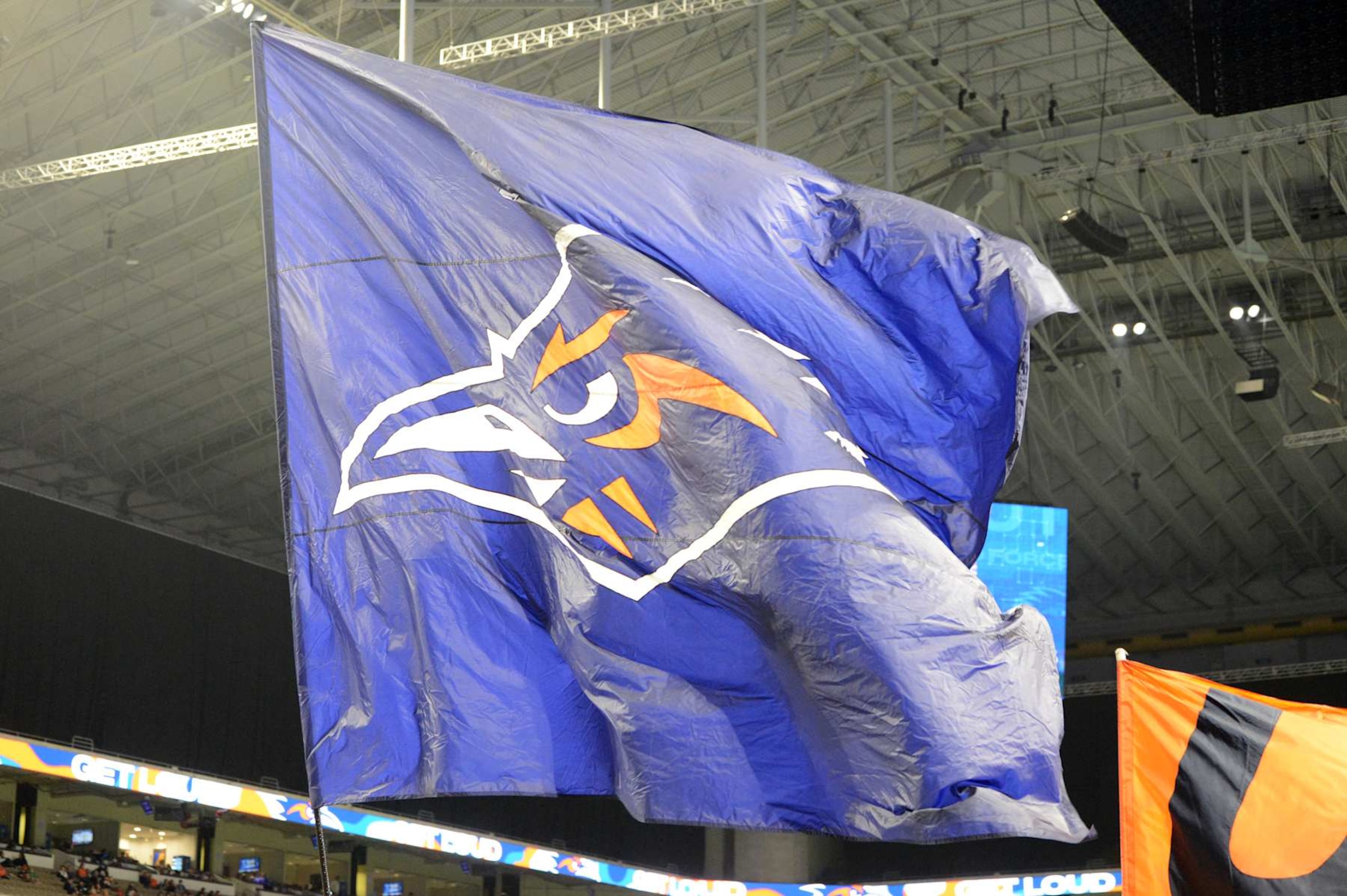 SAN ANTONIO, TX - NOVEMBER 15: The UTSA Roadrunners flag is run across the field during game between the North Texas Mean Green and the UTSA Roadrunners on November 15, 2024 at the Alamodome in San Antonio, TX. (Photo by John Rivera/Icon Sportswire via Getty Images)
