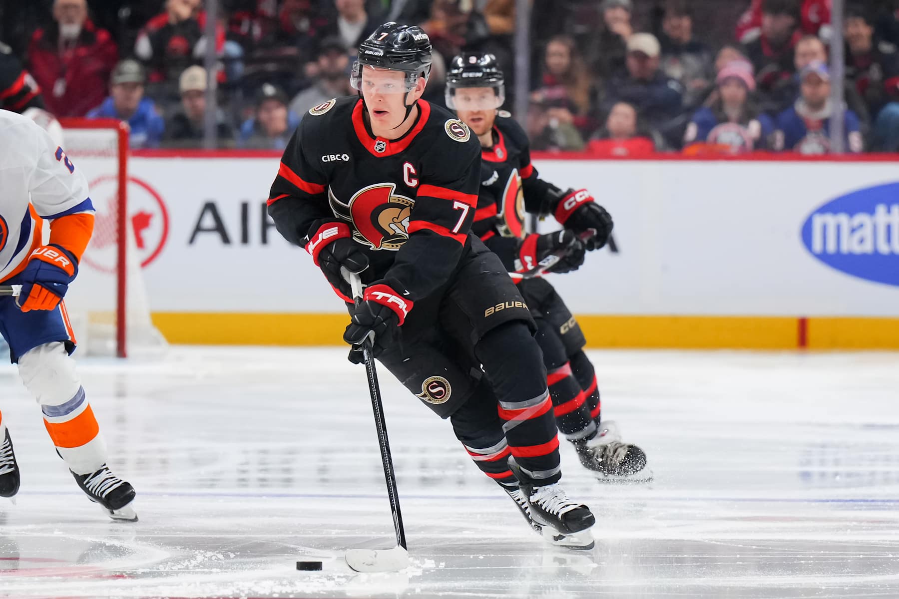 OTTAWA, CANADA - DECEMBER 8: Brady Tkachuk #7 of the Ottawa Senators skates against the New York Islanders at Canadian Tire Centre on December 8, 2024 in Ottawa, Ontario, Canada. (Photo by André Ringuette/NHLI via Getty Images)