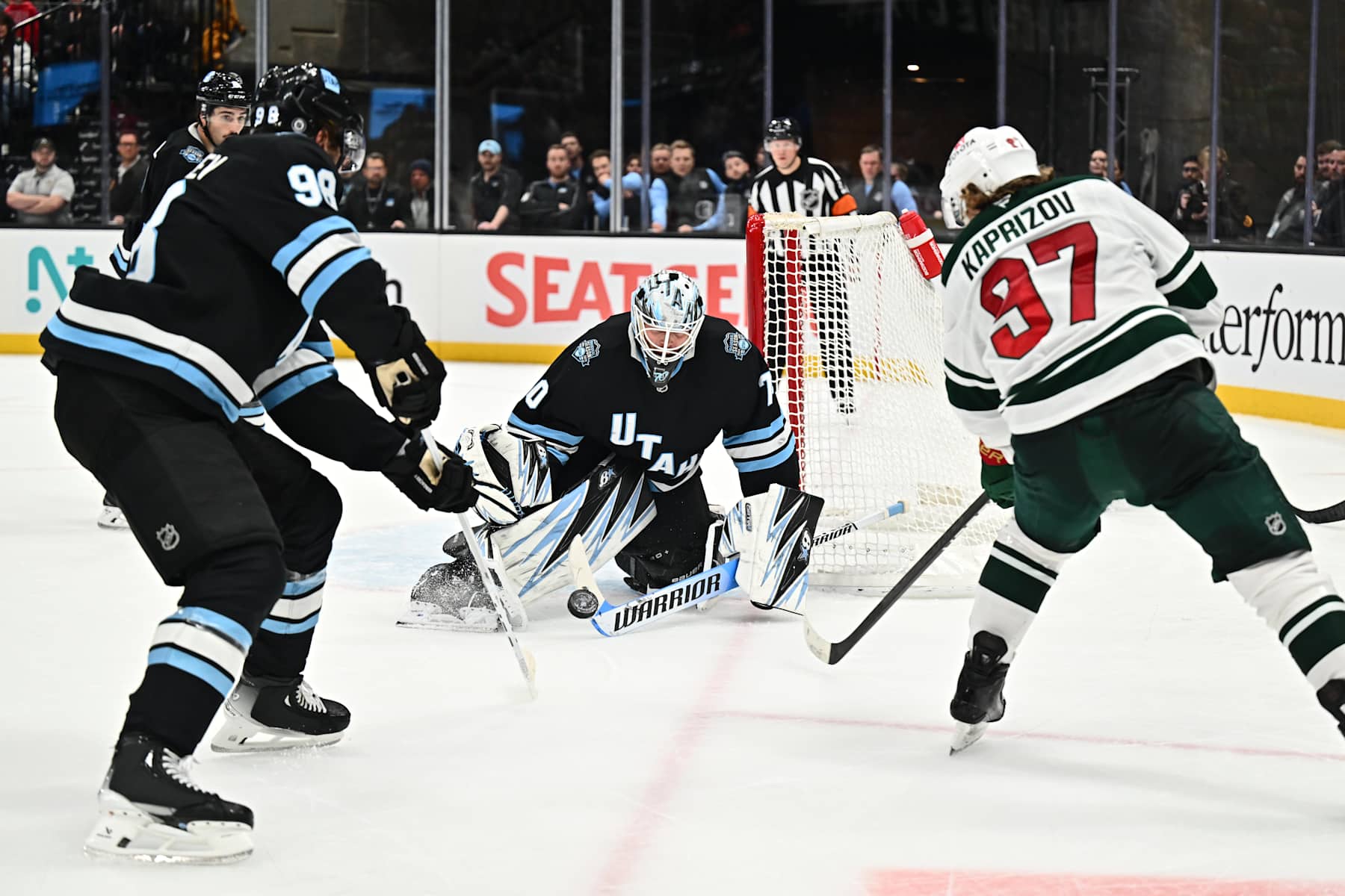 SALT LAKE CITY, UTAH - DECEMBER 10: Goaltender Karel Vejmelka #70 of the Utah Hockey Club blocks a shot taken by Kirill Kaprizov #97 of the Minnesota Wild during the overtime period of a game on December 10, 2024 at Delta Center in Salt Lake City, Utah. (Photo by Jamie Sabau/NHLI via Getty Images)