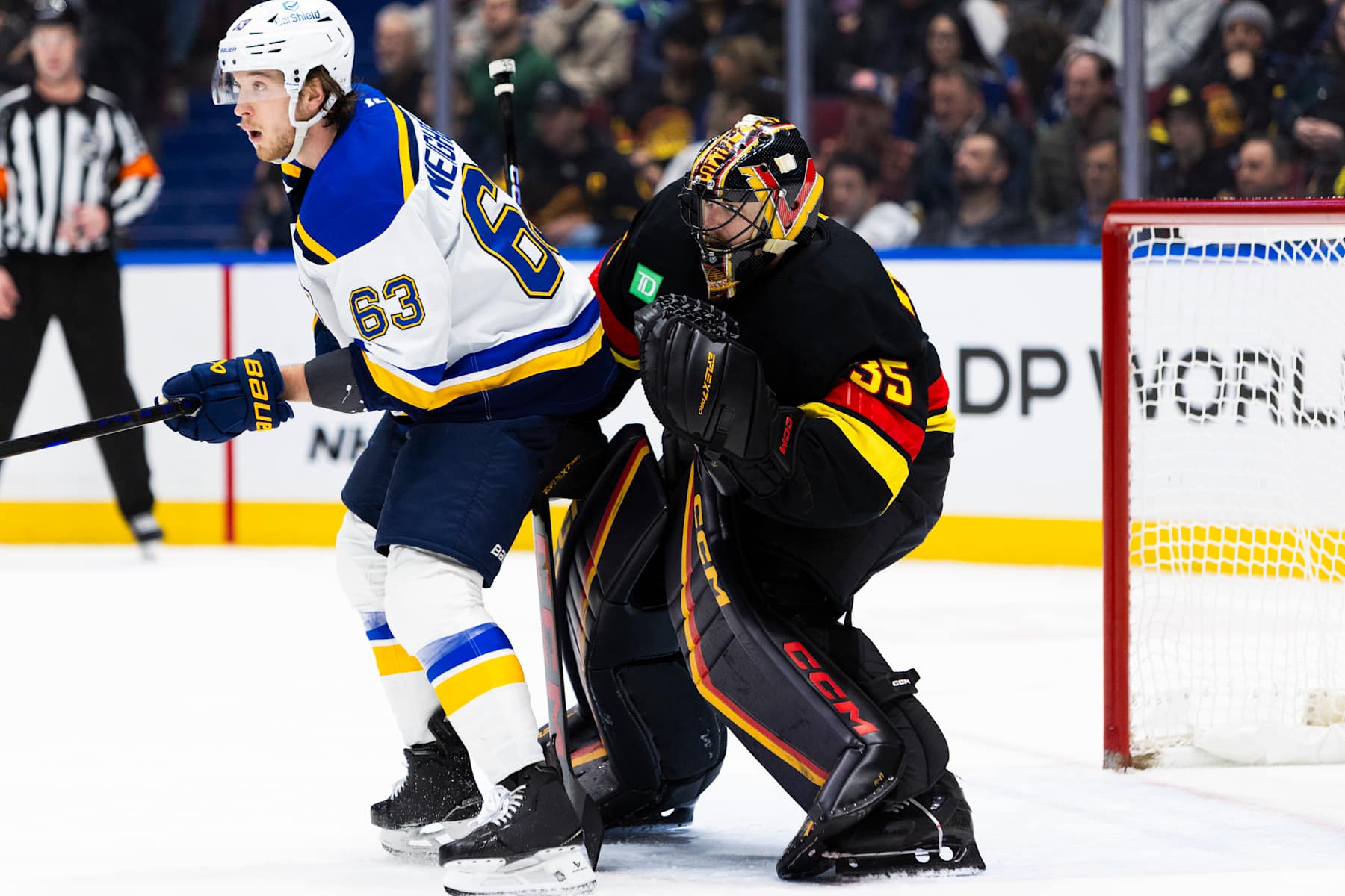 VANCOUVER, BC - DECEMBER 10: Vancouver Canucks goaltender Thatcher Demko (35) is screened by St. Louis Blues left wing Jake Neighbours (63) during an NHL game between the St. Louis Blues and the Vancouver Canucks on Tuesday December 10, 2024 at Rogers Arena in Vancouver, B.C. (Photo by Jamie Douglas/Icon Sportswire via Getty Images)