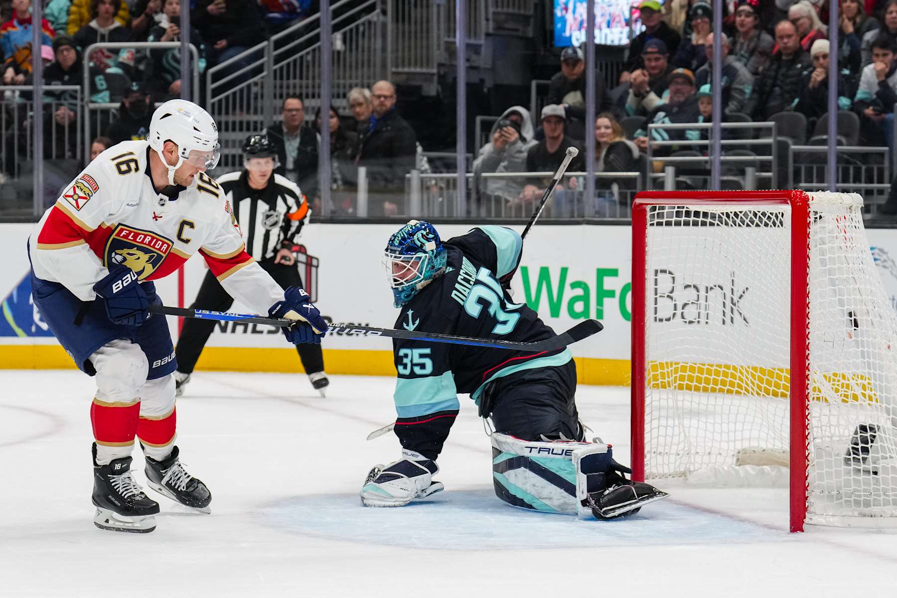 SEATTLE, WASHINGTON - DECEMBER 10: Aleksander Barkov #16 of the Florida Panthers scores a goal during the shoot out period of a game against the Seattle Kraken at Climate Pledge Arena on December 10, 2024 in Seattle, Washington. (Photo by Christopher Mast/NHLI via Getty Images)