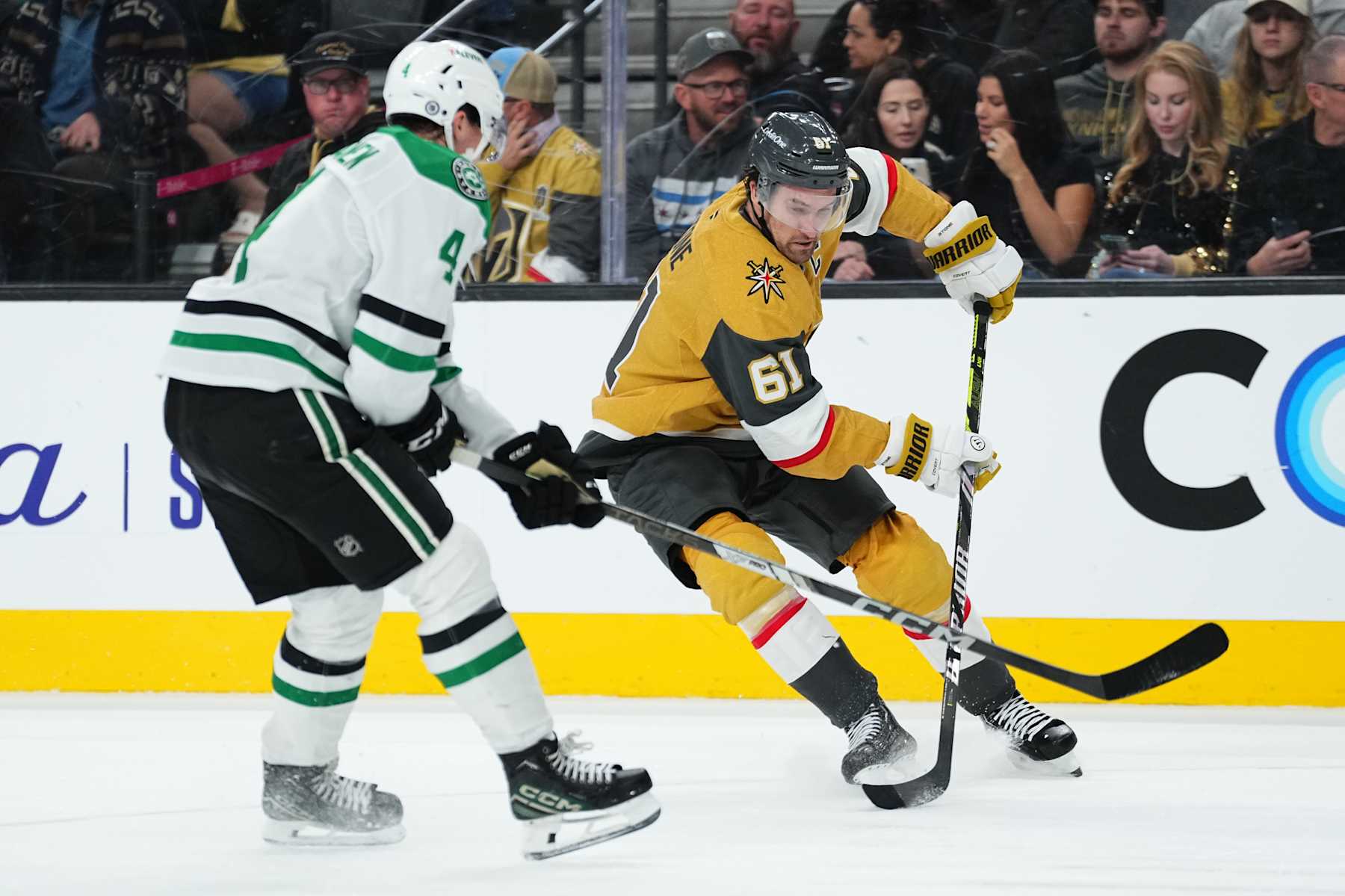 LAS VEGAS, NEVADA - DECEMBER 06: Mark Stone #61 of the Vegas Golden Knights skates against Miro Heiskanen #4 of the Dallas Stars during the third period at T-Mobile Arena on December 06, 2024 in Las Vegas, Nevada. (Photo by Jeff Bottari/NHLI via Getty Images)