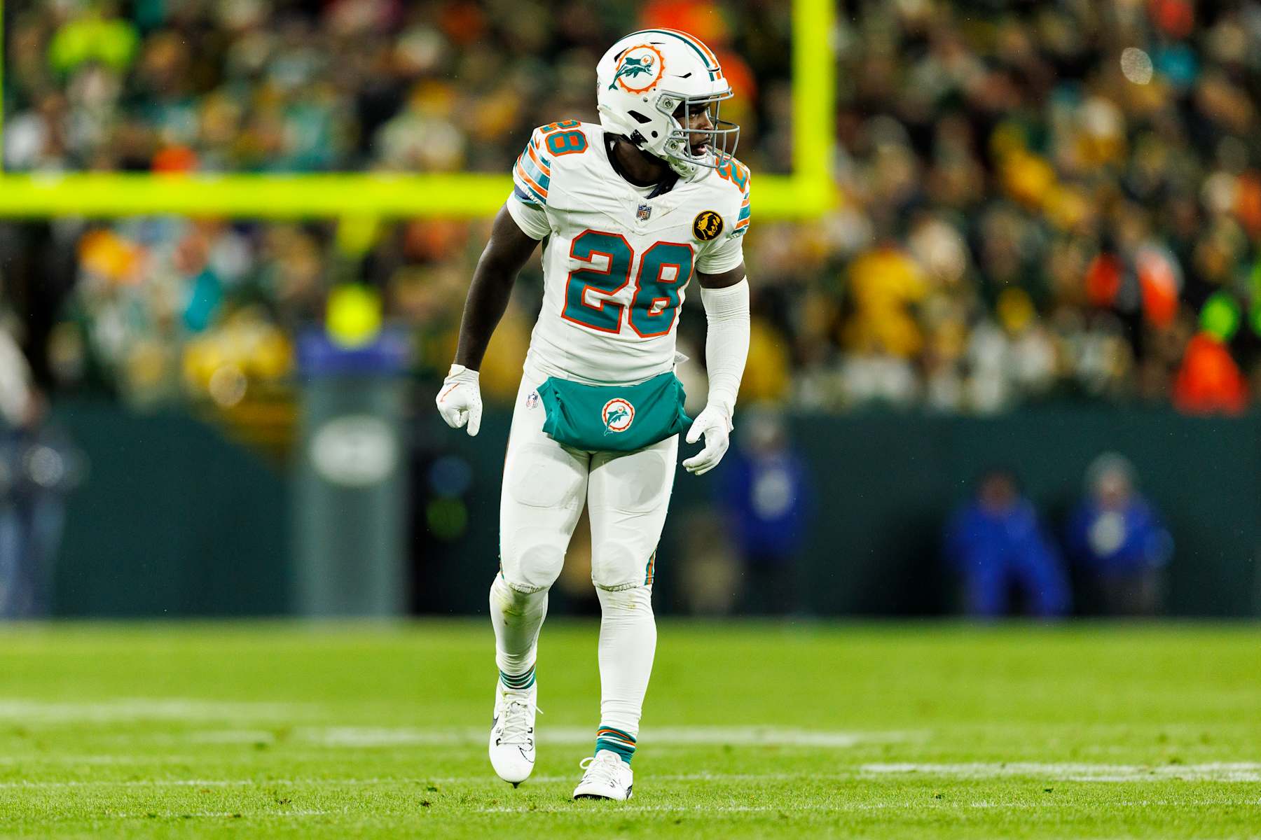 GREEN BAY, WISCONSIN - NOVEMBER 28: Running back De'Von Achane #28 of the Miami Dolphins gets set during an NFL game against the Green Bay Packers at Lambeau Field on November 28, 2024 in Green Bay, Wisconsin. (Photo by Brooke Sutton/Getty Images)