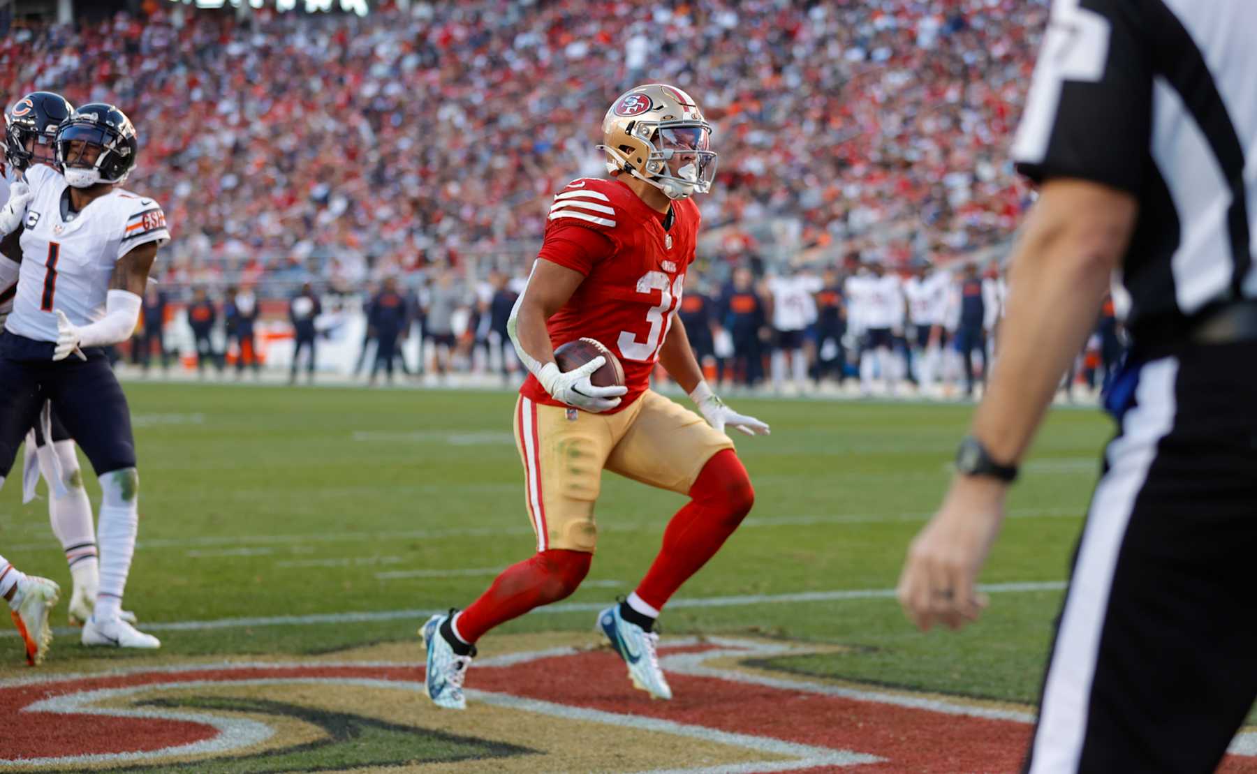 SANTA CLARA, CA - DECEMBER 8: Isaac Guerendo #31 of the San Francisco 49ers rushes for a 4-yard touchdown during the game against the Chicago Bears at Levi's Stadium on December 8, 2024 in Santa Clara, California. The 49ers defeated the Bears 38-13. (Photo by Michael Zagaris/San Francisco 49ers/Getty Images)