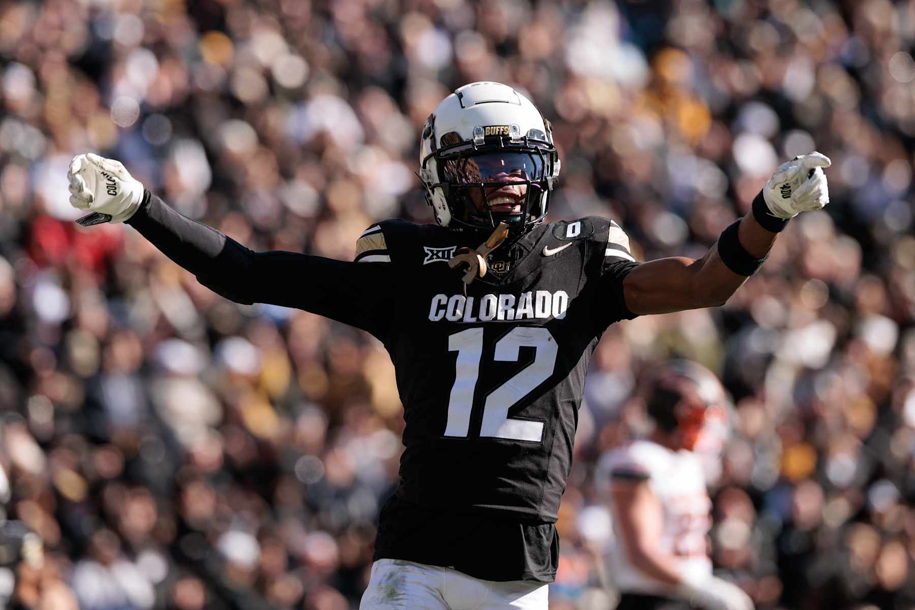 BOULDER, COLORADO - NOVEMBER 29: Travis Hunter #12 of the Colorado Buffaloes celebrates a touchdown during the third quarter against the Oklahoma State Cowboys at Folsom Field on November 29, 2024 in Boulder, Colorado. (Photo by Andrew Wevers/Getty Images)