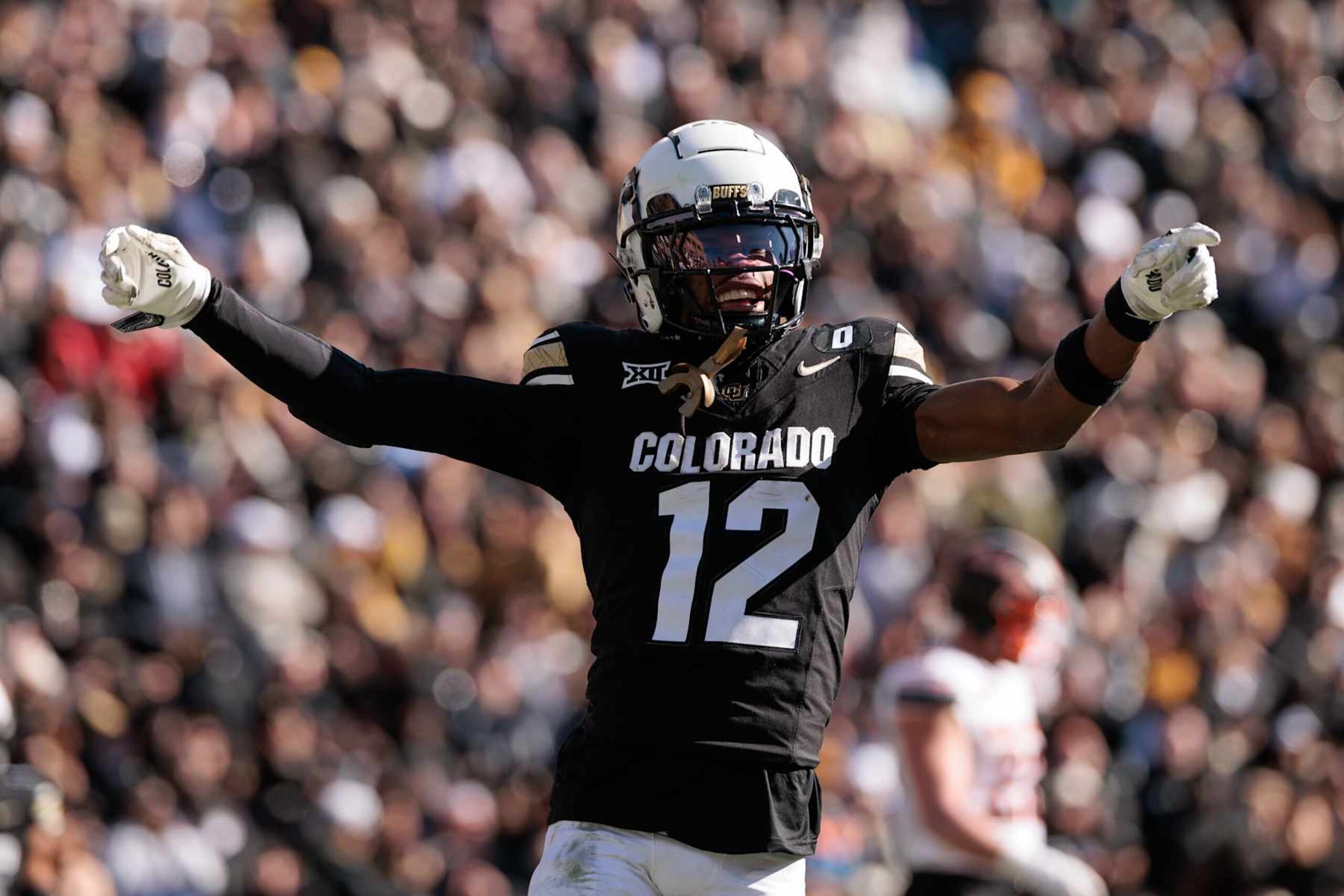 BOULDER, COLORADO - NOVEMBER 29: Travis Hunter #12 of the Colorado Buffaloes celebrates a touchdown during the third quarter against the Oklahoma State Cowboys at Folsom Field on November 29, 2024 in Boulder, Colorado. (Photo by Andrew Wevers/Getty Images)