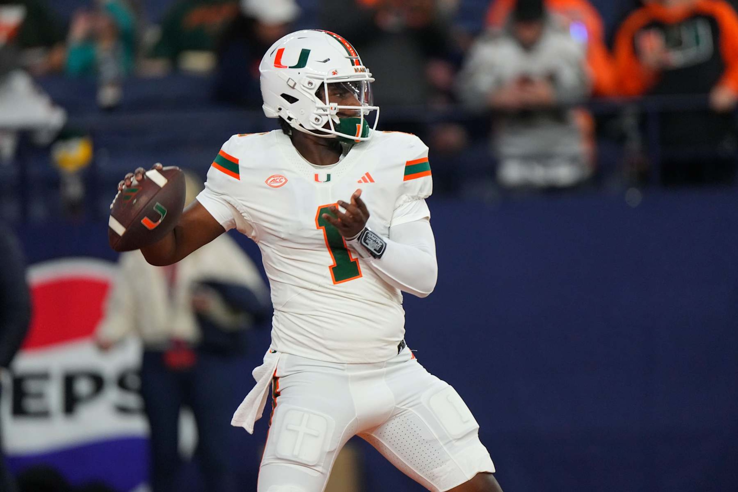 SYRACUSE, NY - NOVEMBER 30: Miami Hurricanes Quarterback Cam Ward (1) warms up prior to the College Football game between the Miami Hurricanes and the Syracuse Orange on November 30, 2024, at the JMA Wireless Dome in Syracuse, NY. (Photo by Gregory Fisher/Icon Sportswire via Getty Images)