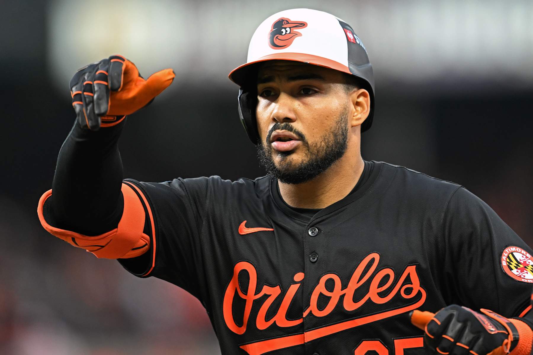 BALTIMORE, MARYLAND - OCTOBER 02: Anthony Santander #25 of the Baltimore Orioles reacts after hitting a single against the Kansas City Royals during the fourth inning of Game Two of the Wild Card Series at Oriole Park at Camden Yards on October 02, 2024 in Baltimore, Maryland.  (Photo by Greg Fiume/Getty Images)