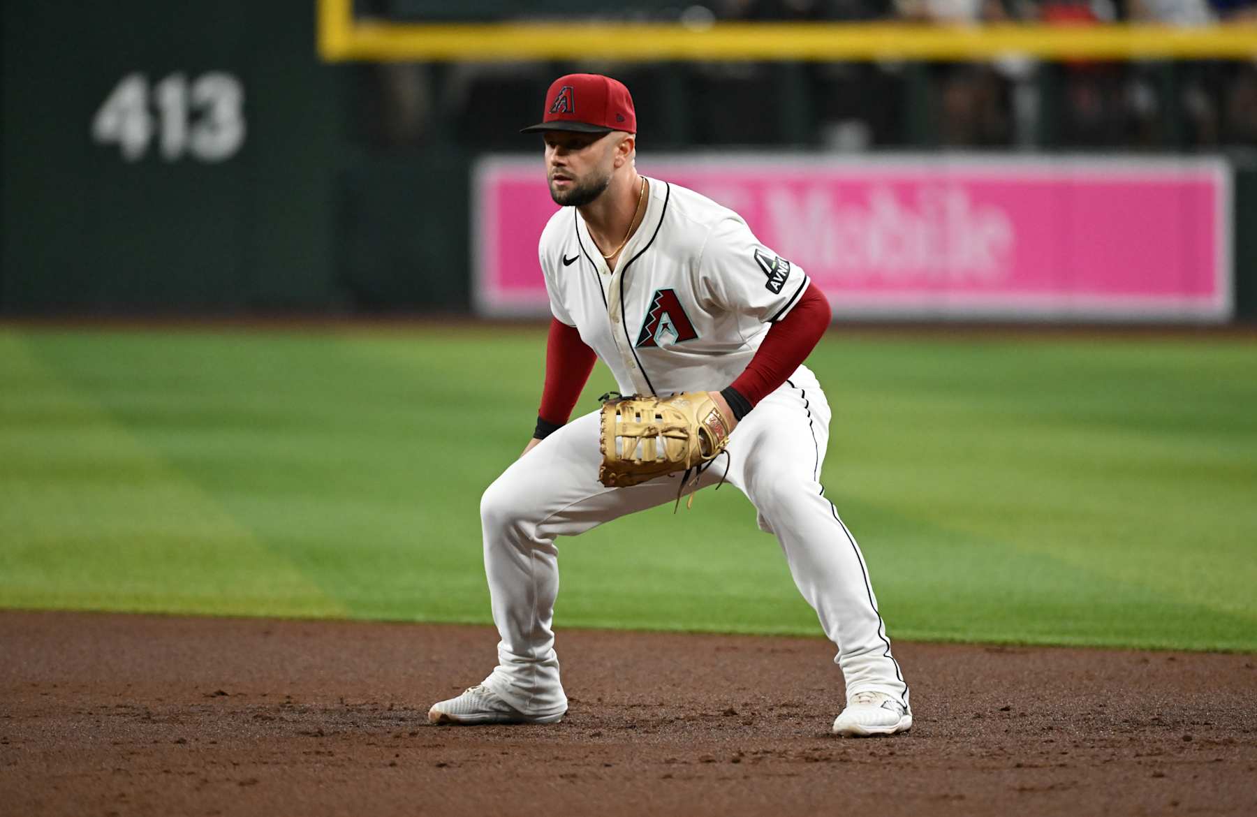 PHOENIX, ARIZONA - SEPTEMBER 11: Christian Walker #53 of the Arizona Diamondbacks gets ready to make a play against the Texas Rangers at Chase Field on September 11, 2024 in Phoenix, Arizona. (Photo by Norm Hall/Getty Images)