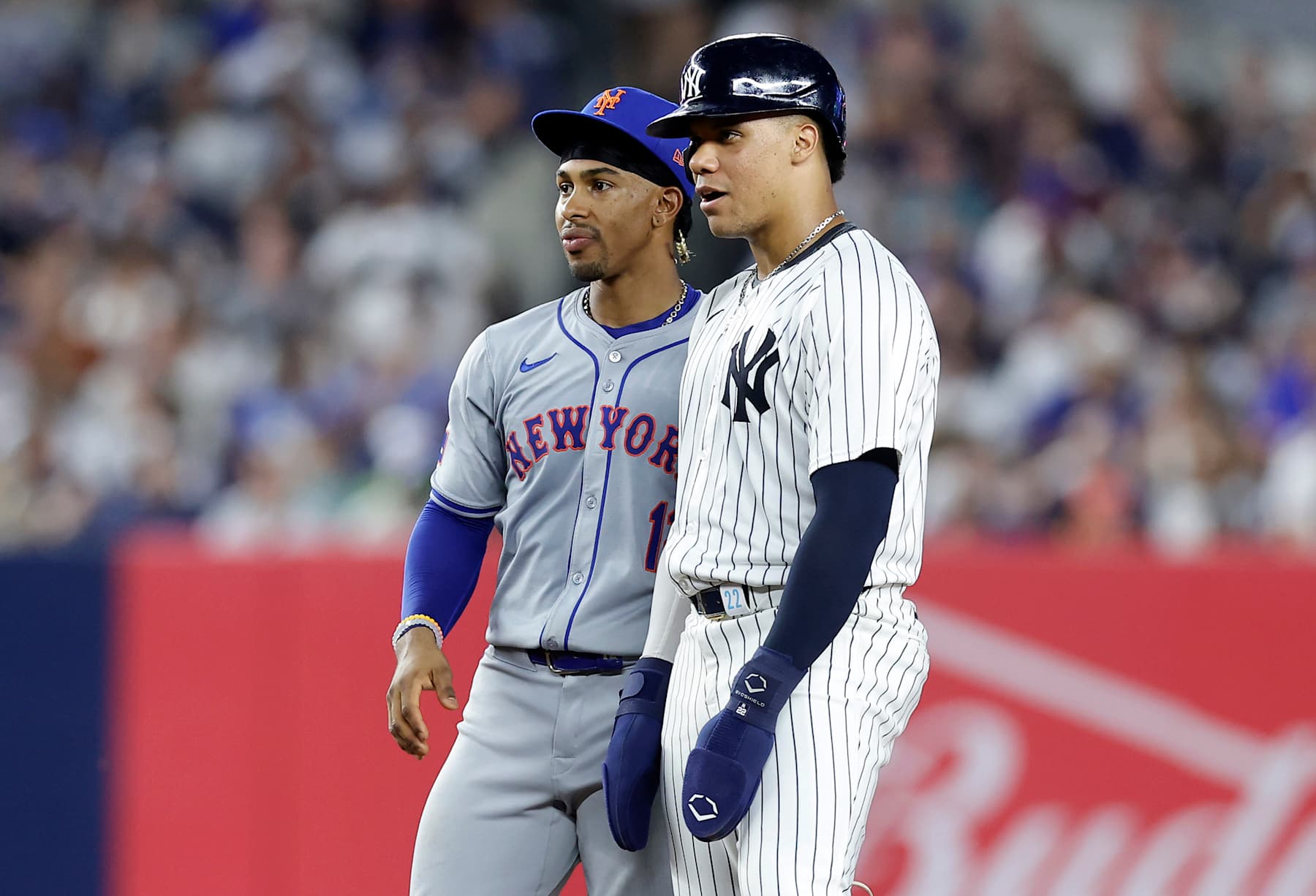 NEW YORK, NEW YORK - JULY 24:  Juan Soto #22 of the New York Yankees stands at second base with Francisco Lindor #12 of the New York Mets during the fifth inning of their game at Yankee Stadium on July 24, 2024 in New York City. (Photo by Jim McIsaac/Getty Images)