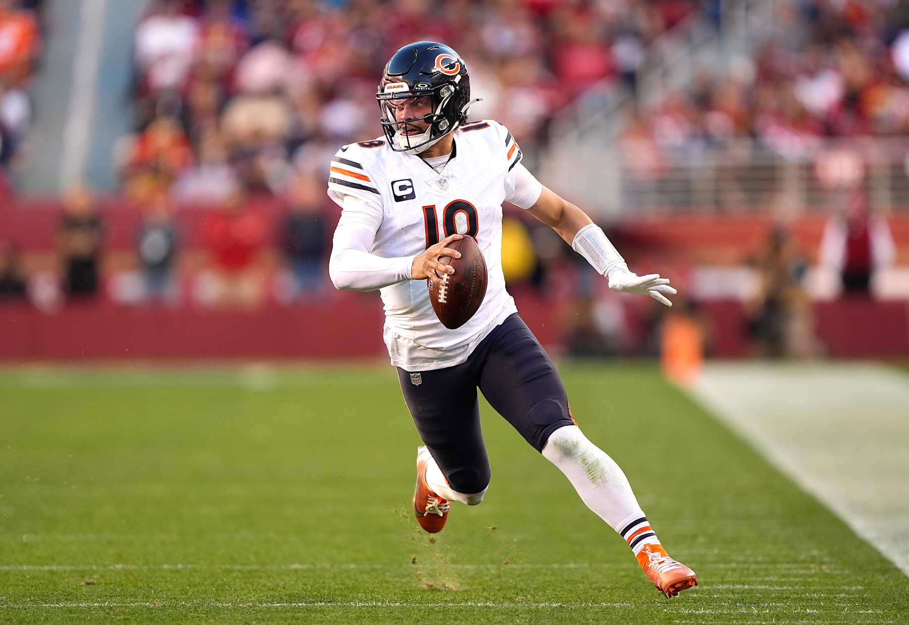SANTA CLARA, CALIFORNIA - DECEMBER 08: Caleb Williams #18 of the Chicago Bears runs with the ball against the San Francisco 49ers in the fourth quarter at Levi's Stadium on December 08, 2024 in Santa Clara, California. (Photo by Thearon W. Henderson/Getty Images)