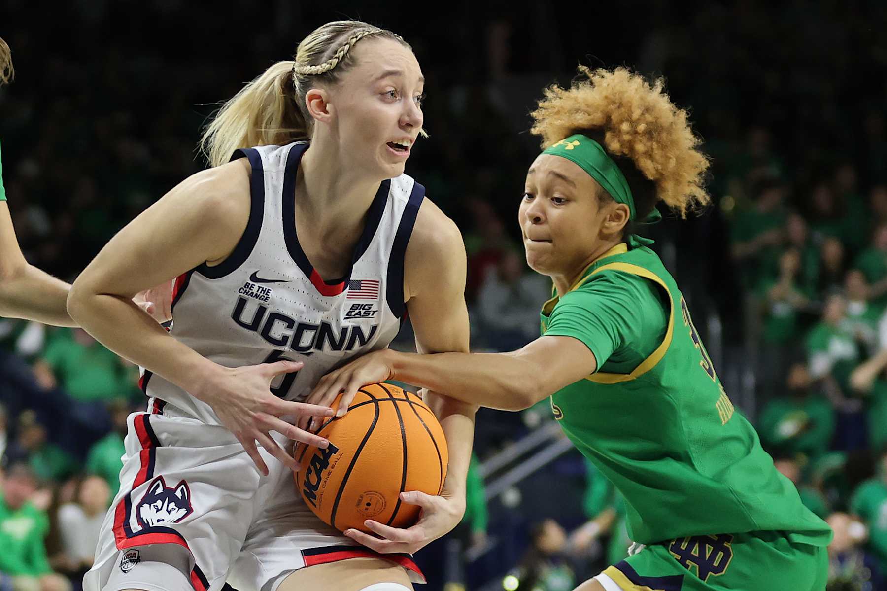 SOUTH BEND, INDIANA - DECEMBER 12: Paige Bueckers #5 of the UConn Huskies is defended by Hannah Hidalgo #3 of the Notre Dame Fighting Irish during the first half at Purcell Pavilion at the Joyce Center on December 12, 2024 in South Bend, Indiana. (Photo by Michael Reaves/Getty Images)
