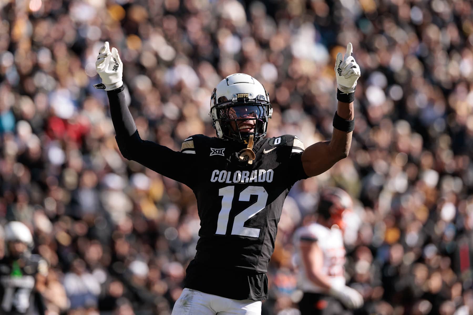 BOULDER, COLORADO - NOVEMBER 29: Travis Hunter #12 of the Colorado Buffaloes celebrates a touchdown during the third quarter against the Oklahoma State Cowboys at Folsom Field on November 29, 2024 in Boulder, Colorado. (Photo by Andrew Wevers/Getty Images)